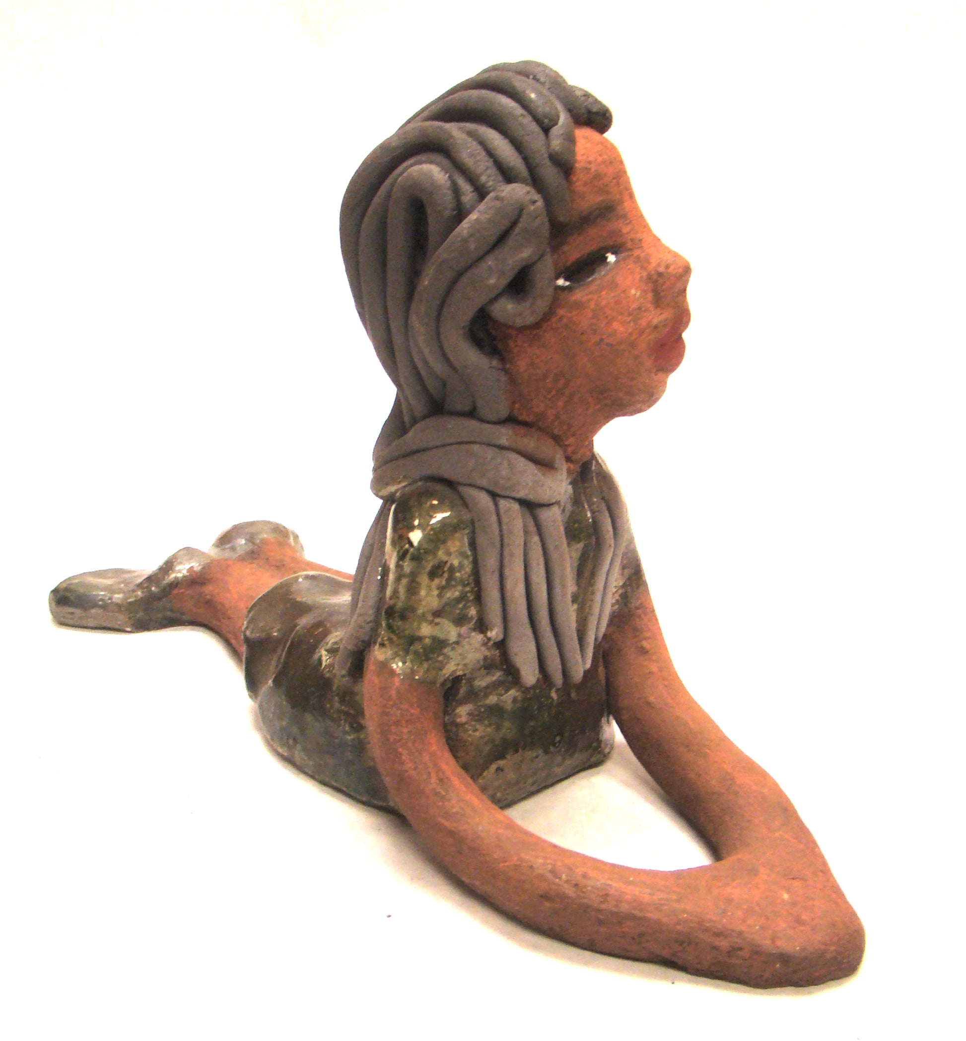 Meet Ashlie!      Ashlie stands 6" x 3" x 8.5" and weighs 1.6 lbs.     Ashlie has a lovely copper brown complexion and smokey black hair.     She wears a metallic copper dress and shoes.     Her long loving arms are placed in front of her as she rest.  Give Ashlie a nice spot to relax in your home!