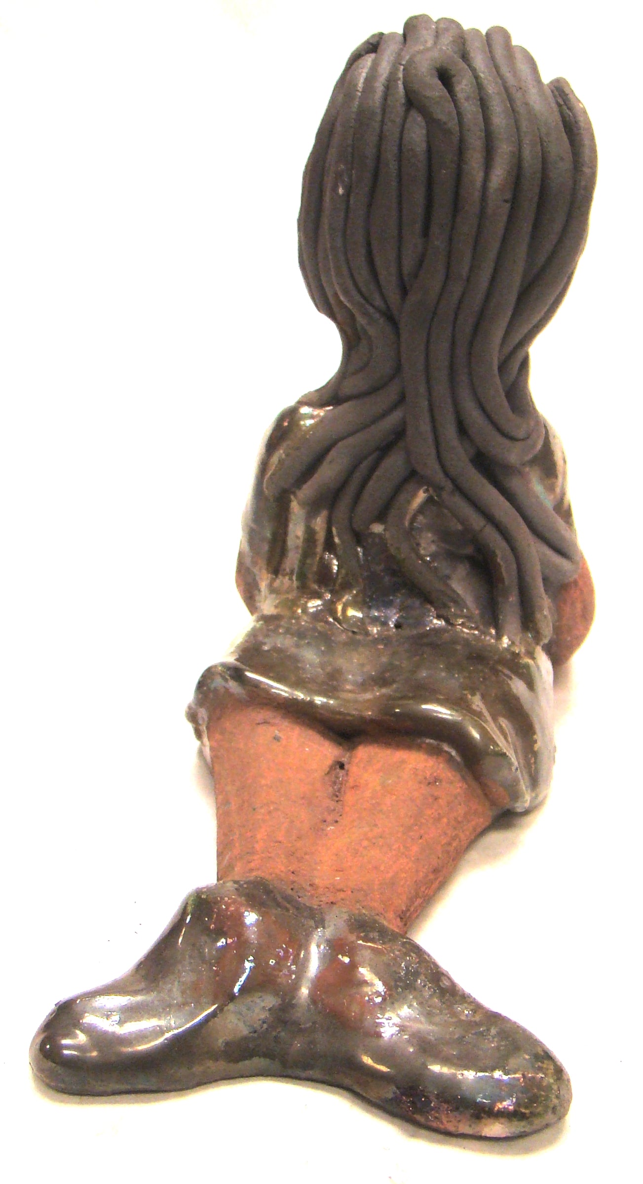 Meet Ashlie!      Ashlie stands 6" x 3" x 8.5" and weighs 1.6 lbs.     Ashlie has a lovely copper brown complexion and smokey black hair.     She wears a metallic copper dress and shoes.     Her long loving arms are placed in front of her as she rest.  Give Ashlie a nice spot to relax in your home!