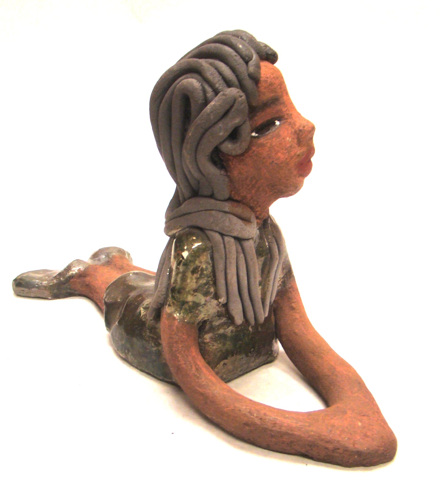 Meet Ashlie! Ashlie stands 6" x 3" x 8.5" and weighs 1.6 lbs. Ashlie has a lovely copper brown complexion and smokey black hair. She wears a metallic copper dress and shoes. Her long loving arms are placed in front of her as she rest. Give Ashlie a nice spot to relax in your home!
