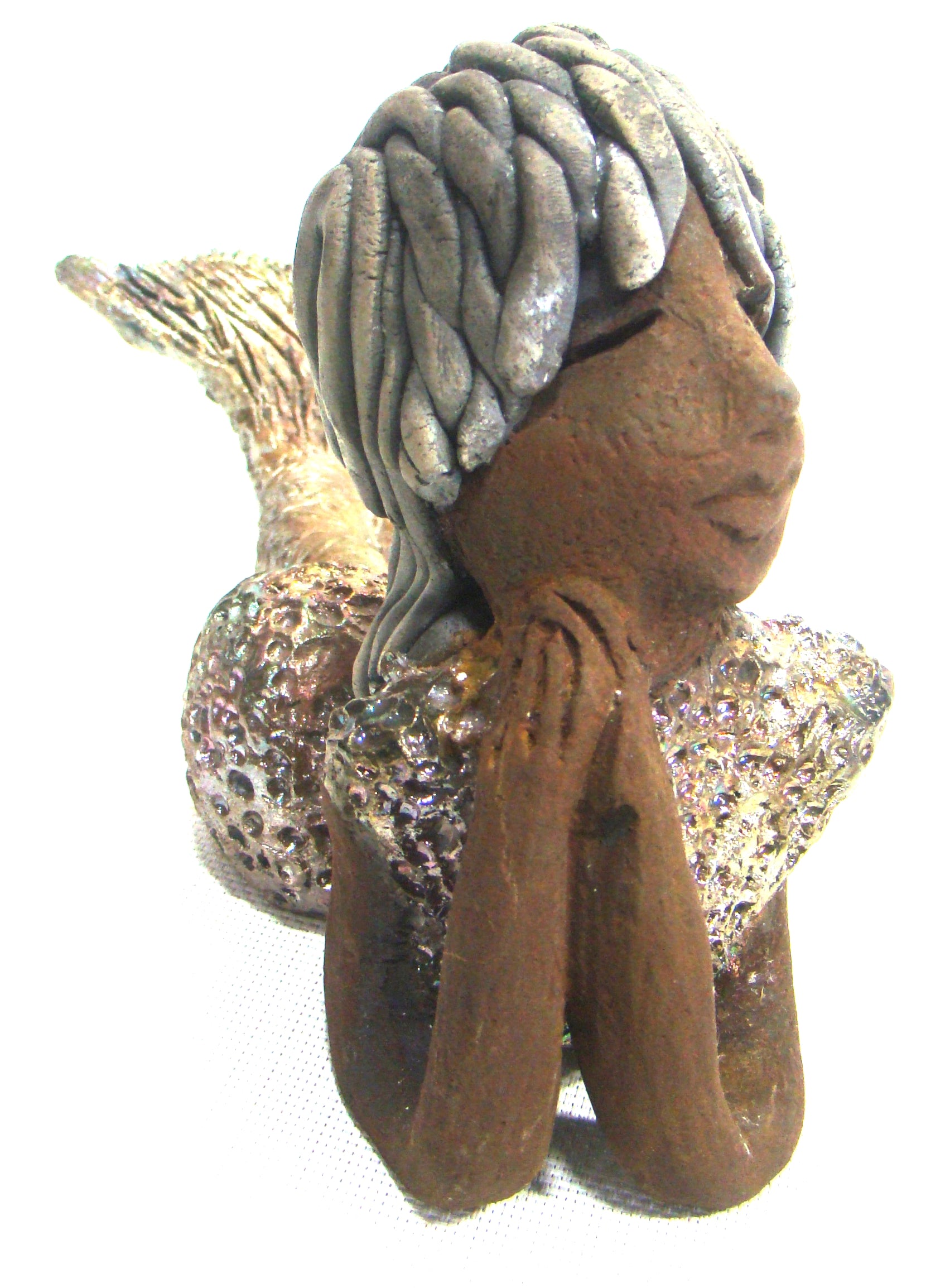 Meet Belinda!      Belinda is a voluptuous mermaid.     She stands 6.5" X 5" 9.5" and weighs 2.04 lbs.     Belinda has a dark chocolate complexion.     She wears a  dark smokey clay hairstyle.     She wears a glossy metallic swimsuit.     Belinda has a wide tail.     She will  definitely get somebody's attention.