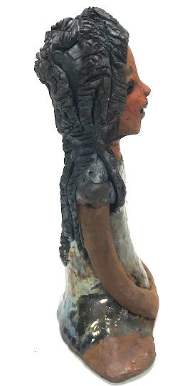 Meet Brenda!      Brenda stands &' x 4" x 2.5" and weighs 11 ozs.     She has a lovely honey brown complexion.     Brenda wears a metallic green dress.     Her hair is smokey black.and made of clay.     Brends's long loving arms rest at her side.  Brenda will make a great gift or a starter piece from the Herdew Collection!