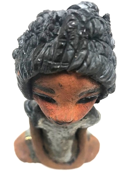 Meet Brenda! Brenda stands &' x 4" x 2.5" and weighs 11 ozs. She has a lovely honey brown complexion. Brenda wears a metallic green dress. Her hair is smokey black.and made of clay. Brends's long loving arms rest at her side. Brenda will make a great gift or a starter piece from the Herdew Collection!