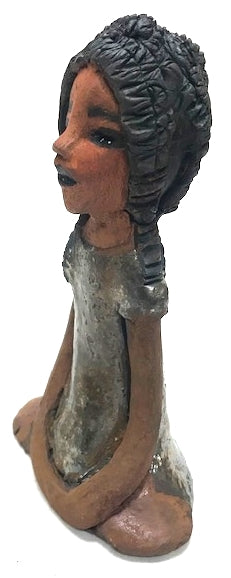 Meet Brenda!      Brenda stands &' x 4" x 2.5" and weighs 11 ozs.     She has a lovely honey brown complexion.     Brenda wears a metallic green dress.     Her hair is smokey black.and made of clay.     Brends's long loving arms rest at her side.  Brenda will make a great gift or a starter piece from the Herdew Collection!