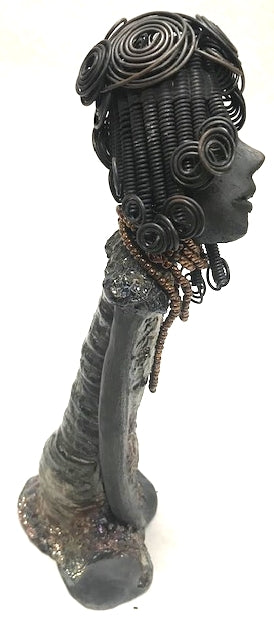 Meet Carolyn!      Carolyn stands 12" x 6" x 4" and weighs 2.4 lbs.     Carolyn as a lovely smokey dark complexion with honey brown eye shadow.'     She wears a textured glossy copper metallic dress.     Carolyn's long loving arms are at her side.     It took three hours to complete her 16 gauge wire Herdew!  Give Carolyn a special place in your home Free Shipping!