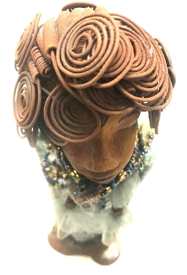 Meet Dorothy!      Dorothy states 15" x 5" x 3 and weighs 2.7 lbs     She has a lovely honey brown complexion.     Dorothy wears a green metallic dress with a beaded tulle around her neck.     It took over 3 hours to complete Dorothy's Herdew.     The hair is made of 16 gauge wire.     Dorothy long loving arms are at her sides.  Give Dorothy as a special gift or a special place in your home.
