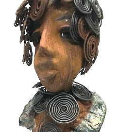 Meet Farida! Farida stand 13”x 5” x 4” and weighs 4 lbs. She has a bright eyes and a beautiful honey brown complexion. Farida has a fancy over the top Herdew. It took two hours to complete! A spiral 16 gauge necklace wraps around her neck. Her dress is a textured metallic green. Farida is looking for a new home.She would make a great gift to a BFF or just for YOU!
