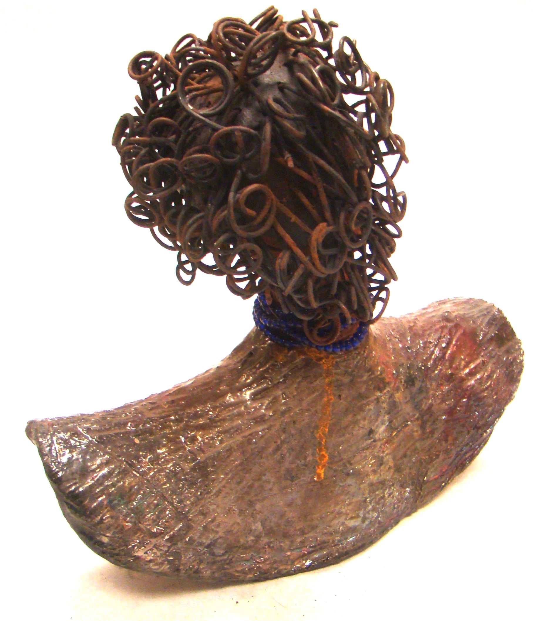Helen stands 8" x  8" x 3" and weighs 2.06 lbs. She has a lovely honey brown complexion. Helen has a metallic copper glaze on her textured robe. Her blue eye shadow matches the blue strand of beads around her neck. Helen has over 20 feet of curly wire hair. Helen is somewhat angelic! Give Helen a prominent place in your home!