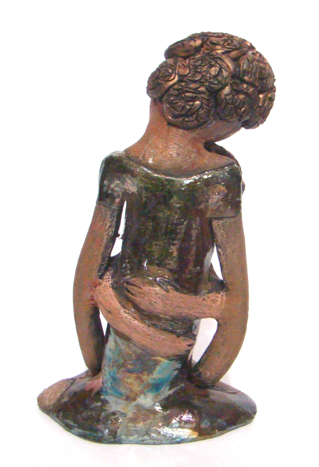 Hold Me Mama depicts the bond between a mother and child. They stand 10" x 5" x 5" and weighs 2.8 lbs. Mother and Child has honey brown complexions with etched...