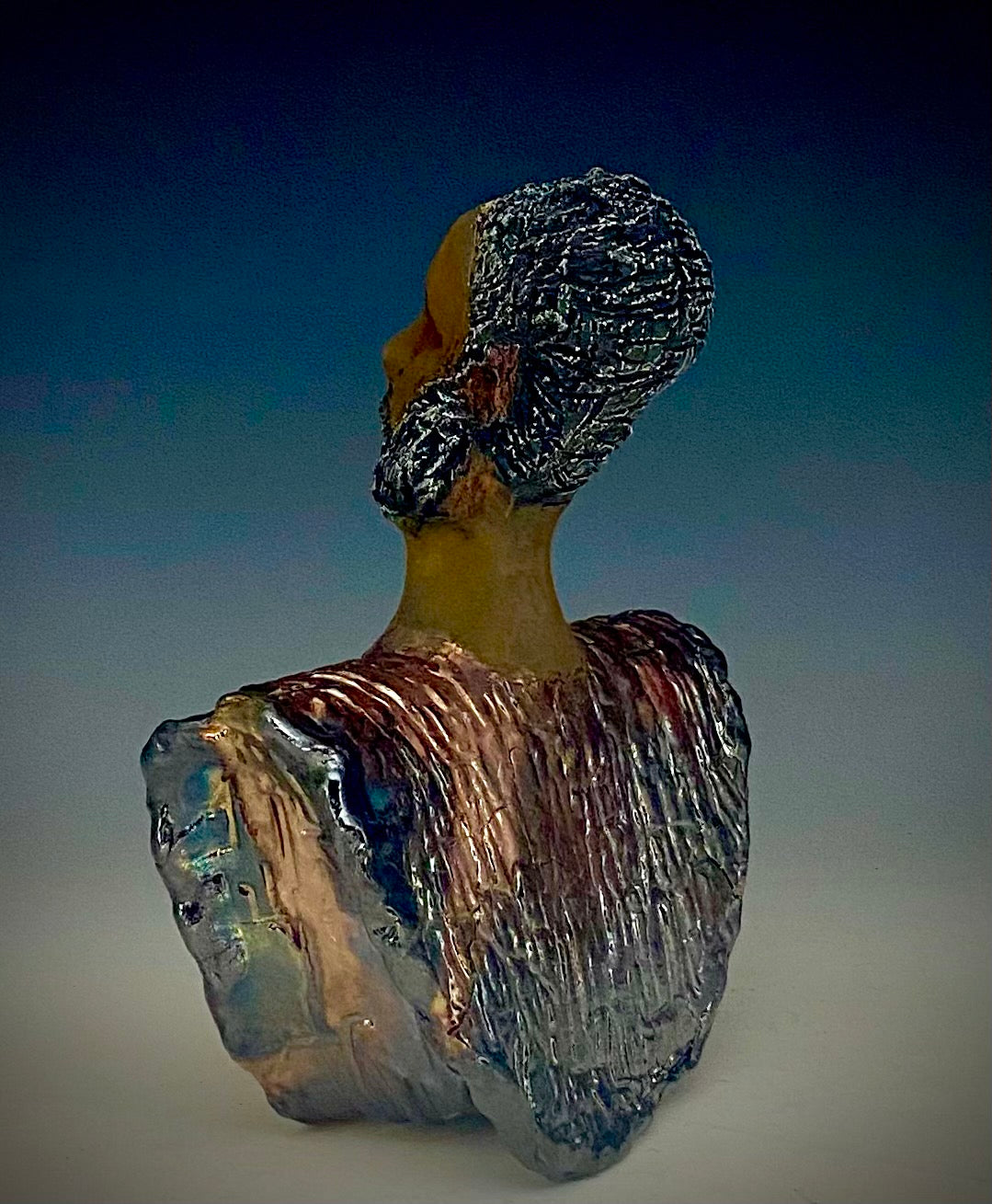 In Memory of April 4, 1968, Dr. Martin Luther King and the Civil Rights Movement. I Am a Man-2 is a declaration of civil rights, often used as a personal statement and as a declaration of independence against oppression. I am a Man stands 9" x 7" x 3.5" and weighs 2 lbs. I am a Man wears a colorful metallic blue and copper dashiki. He is bald and bearded. Yes ,,,,,,He is one of few Men found in the Herdew collection!
