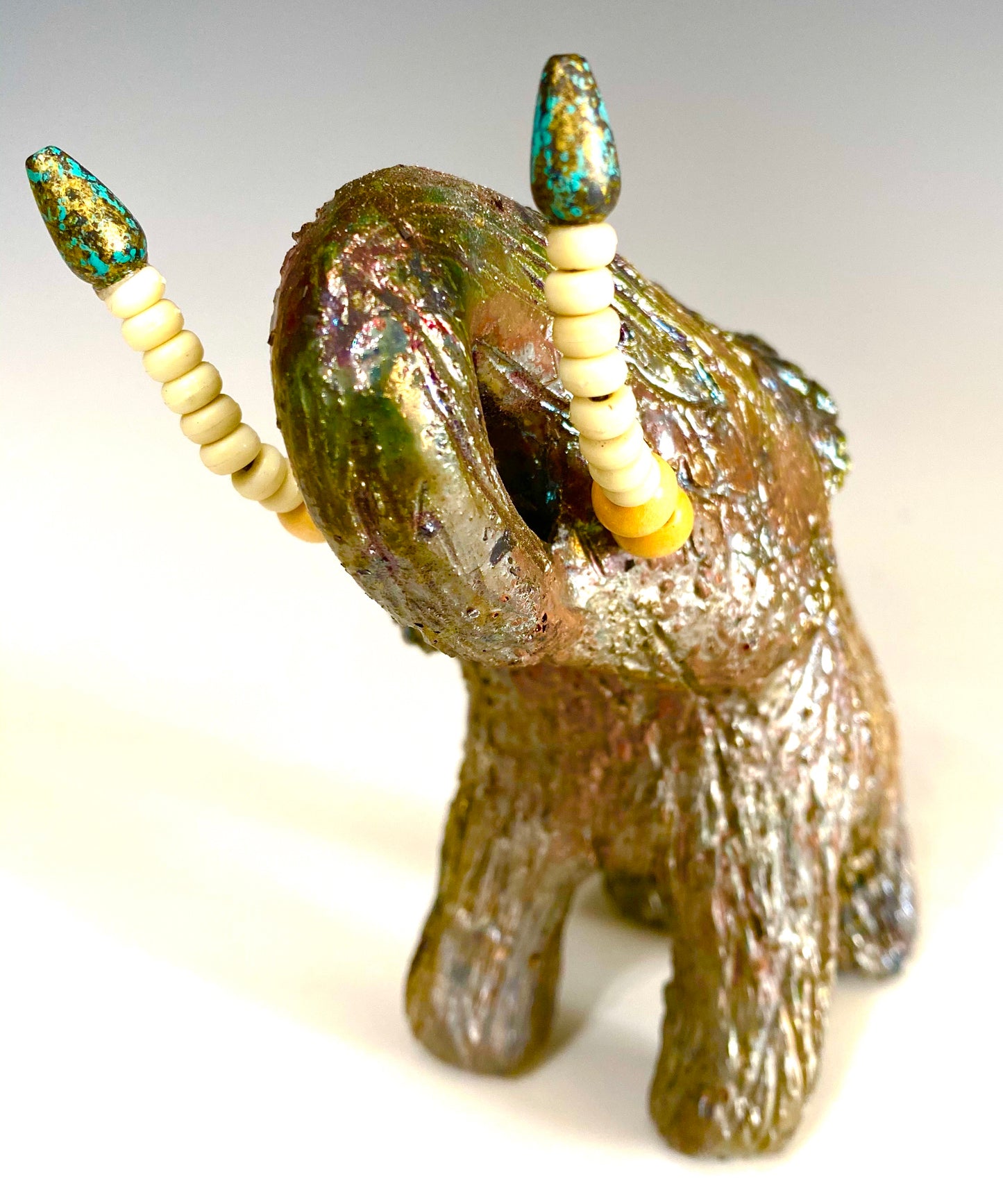Raku Elephant Have you HERD!!!!!! Just one of these lovely Raku Fired Elephant will make an excellent gift for your friend, sorority or for your home’ special place centerpiece. 6" x 3" x 5" 1 lbs Beautiful metallic raku elephant For decorative purposely only