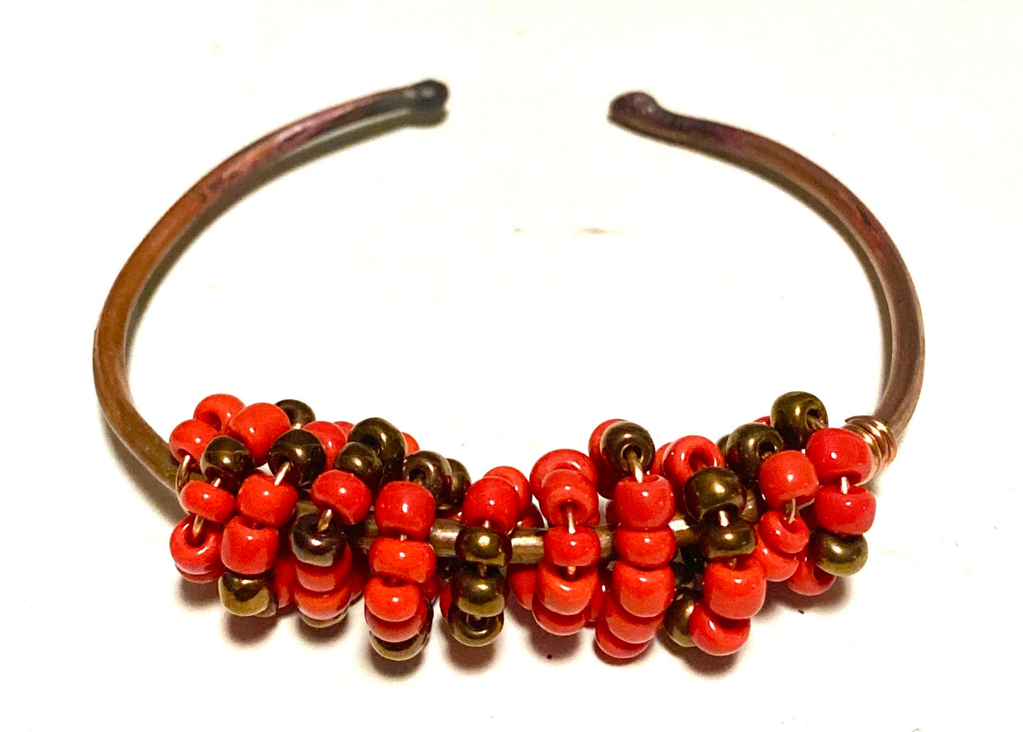 Multi colored red orange and tan beads soft copper band for easy opening adjustments ball ends