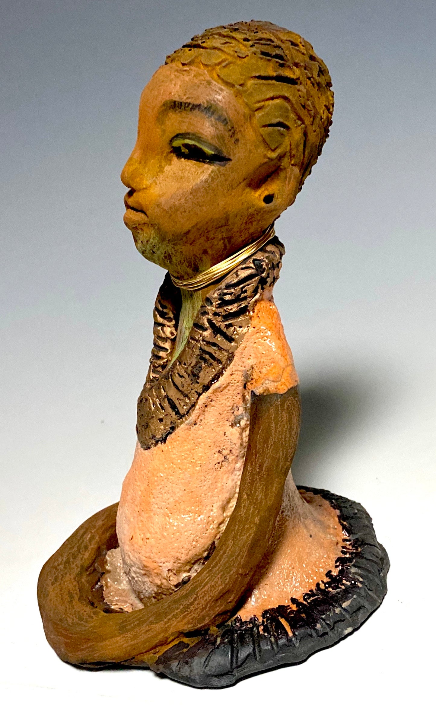 Meet Ernestine! Ernestine stands 7" x 5”x 5" and weighs 1.4 lbs. Ernestine has a lovely pale pink dress with a gold wire necklace. Ernestine appears to sit in a yoga pose. Her long arms rest at her side. With the current situation we All are facing, Ernestine will place a smile on your face during this challenging time. If not, return her within 30 days for a complete refund. Gift Cards are available!!