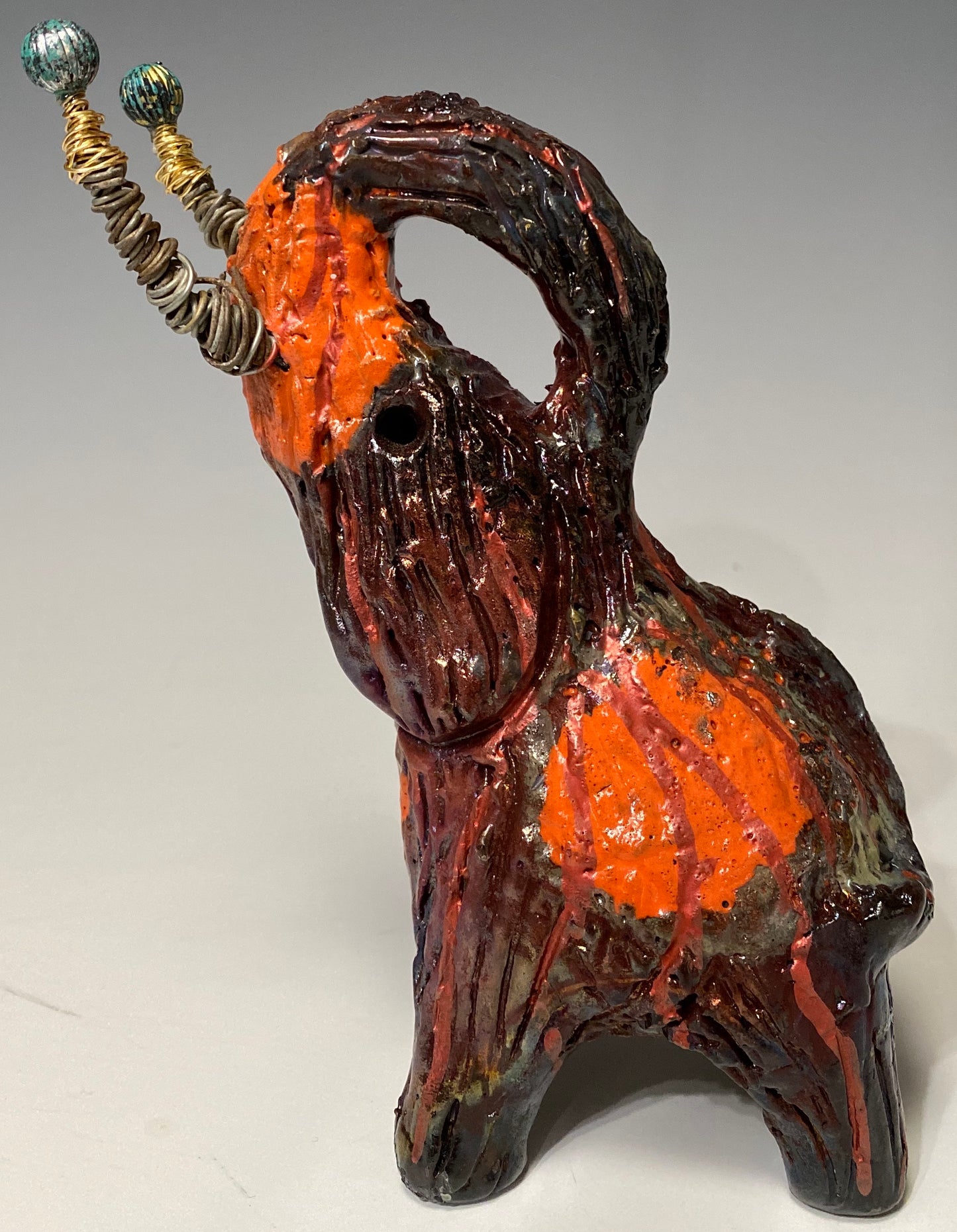 Have you HERD!!!!!! Just one of these lovely Raku Fired Elephant will make an excellent gift for your friend, sorority or for your home’ special place centerpiece. 8.5" x 3" x 5" 15 ozs Beautiful two tone copper and orange rust raku elephant. Beaded tribal tusk. For decorative purposely only