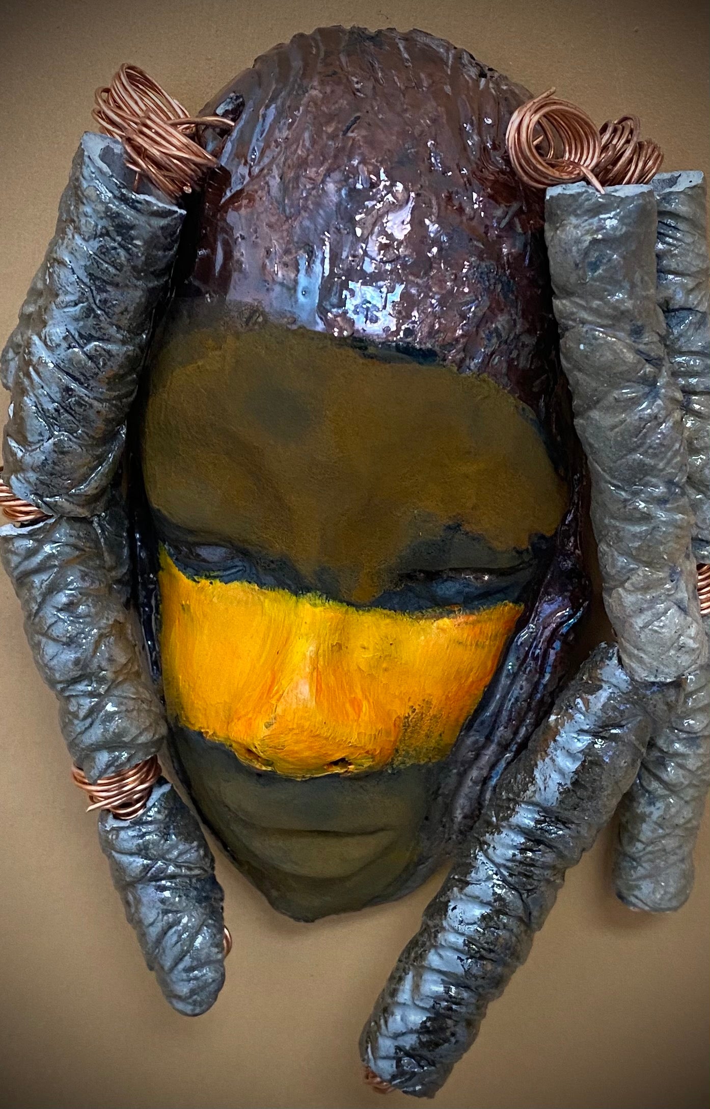 I started making art soon after seeing authentic African artwork at the Smithsonian Museum of African Art. I was in total awe. Lavender was inspired by my visit there. Lavender is 4”x 7” and weighs 10 ozs. She has a two tone copper earthy complexion. Lavender has four spiral off white coils of beaded hair. She is ready to be installed in your home! I suggest a small space with a warm background.