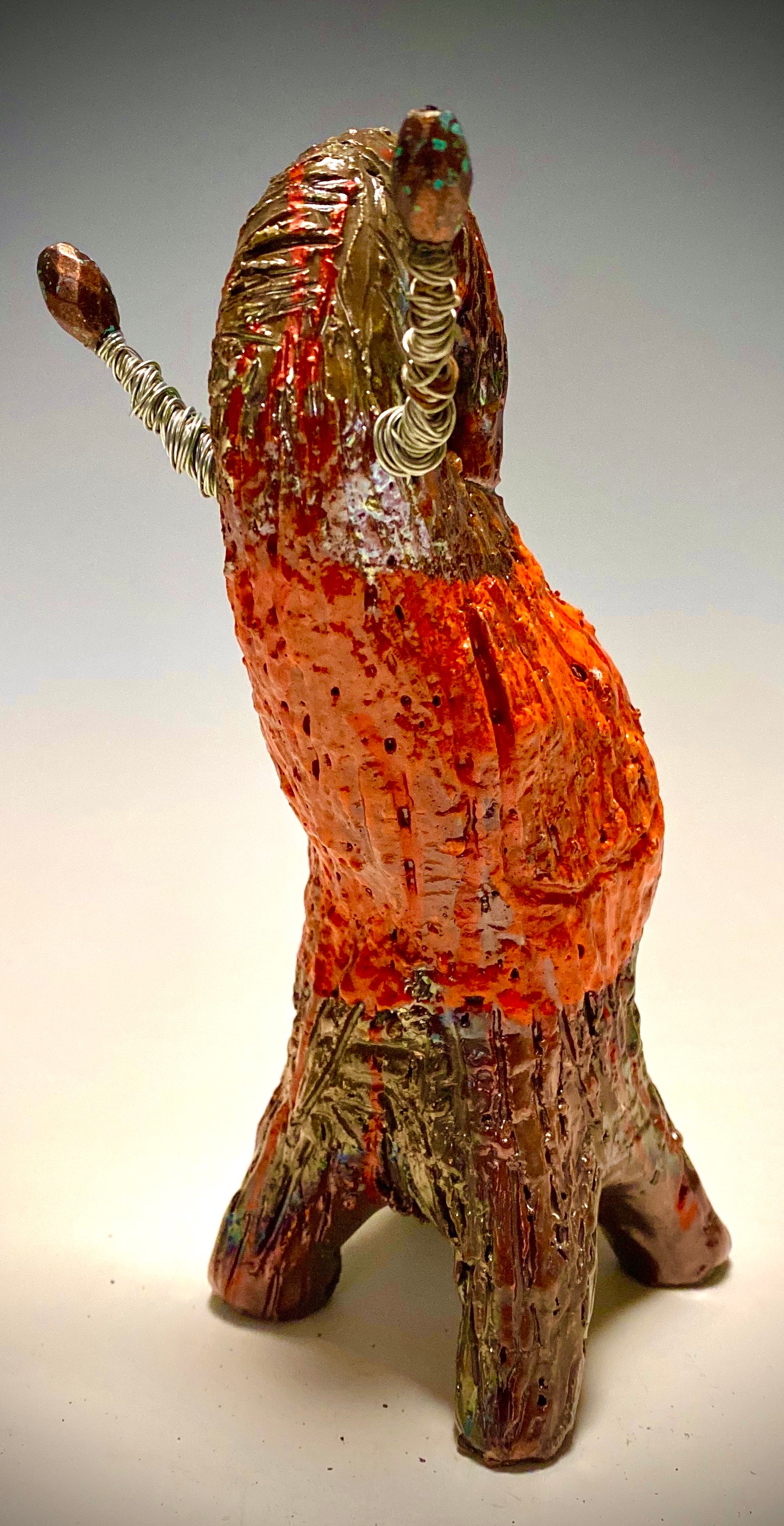 Raku Elephant Have you HERD!!!!!! Just one of these lovely Raku Fired Elephant will make an excellent gift for your friend, sorority or for your home’ special place centerpiece. 8.5" x 3" x 5" 14 ozs Beautiful two tone copper and orange rust raku elephant. Beaded tribal tusk. For decorative purposely only