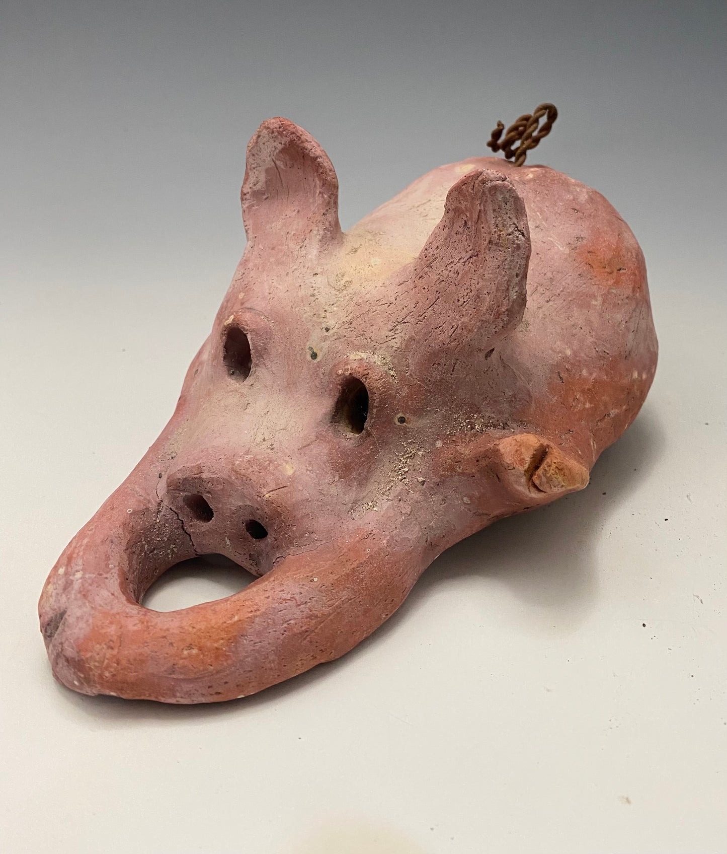 "I have so much fun making this little pig. I started making them about a year ago. I was really surprised at how well they were received at recent art festivals. Boys, girls, men, and women of all ages talked about how cute they are. They got a kick out of and adored the pigs that were named after someone they knew". This Little Piggy named Pauline is 4" x 5' x 8" and weighs 1.8 lbs. Pauline has a matte and satin pinkish complexion. Pauline little curly tail is made of wire