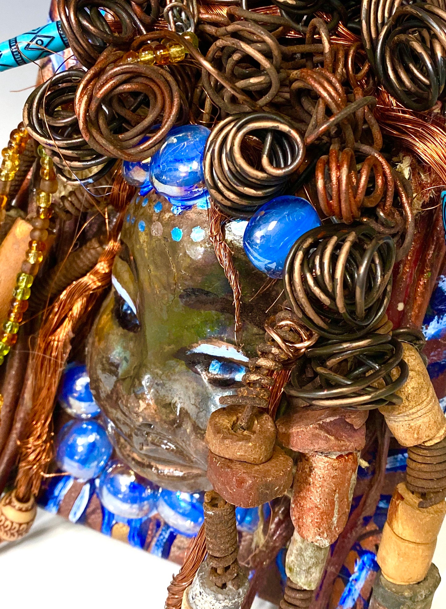 Tyra is mounted on a 5"x 7" painted canvas. I spent about 2 hours or more just fixing Tyra's hair and attaching beads! Tyra has over 30 feet of 16 gauge wire for hair and over 30 raku and wooden beads. Tyra has a silver blue and antique copper crackle face and lips. Tyra is ready to be hung!