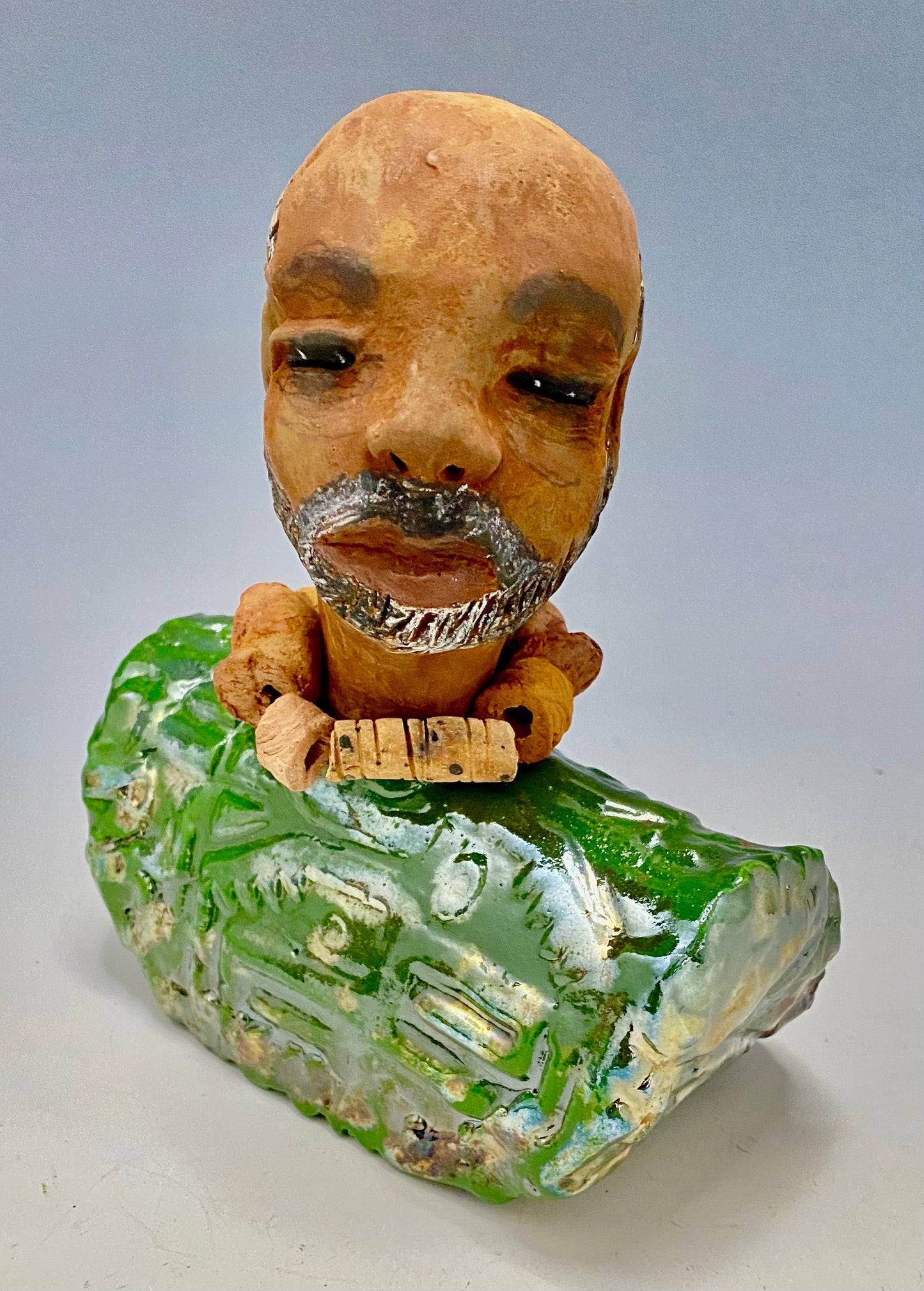 Learning to draw is really a matter of learning to see - to see correctly - and that means a good deal more than merely looking with the eye.- Lester Jones Meet James! Albert stands 7.5" x 6" x 3" and weighs 2.5lbs. Albert wears a colorful metallic copper green dashiki. He is partially bald with a salt and peppered beard. Yes ,,,,,,He is one of few Men found in the Herdew collection!