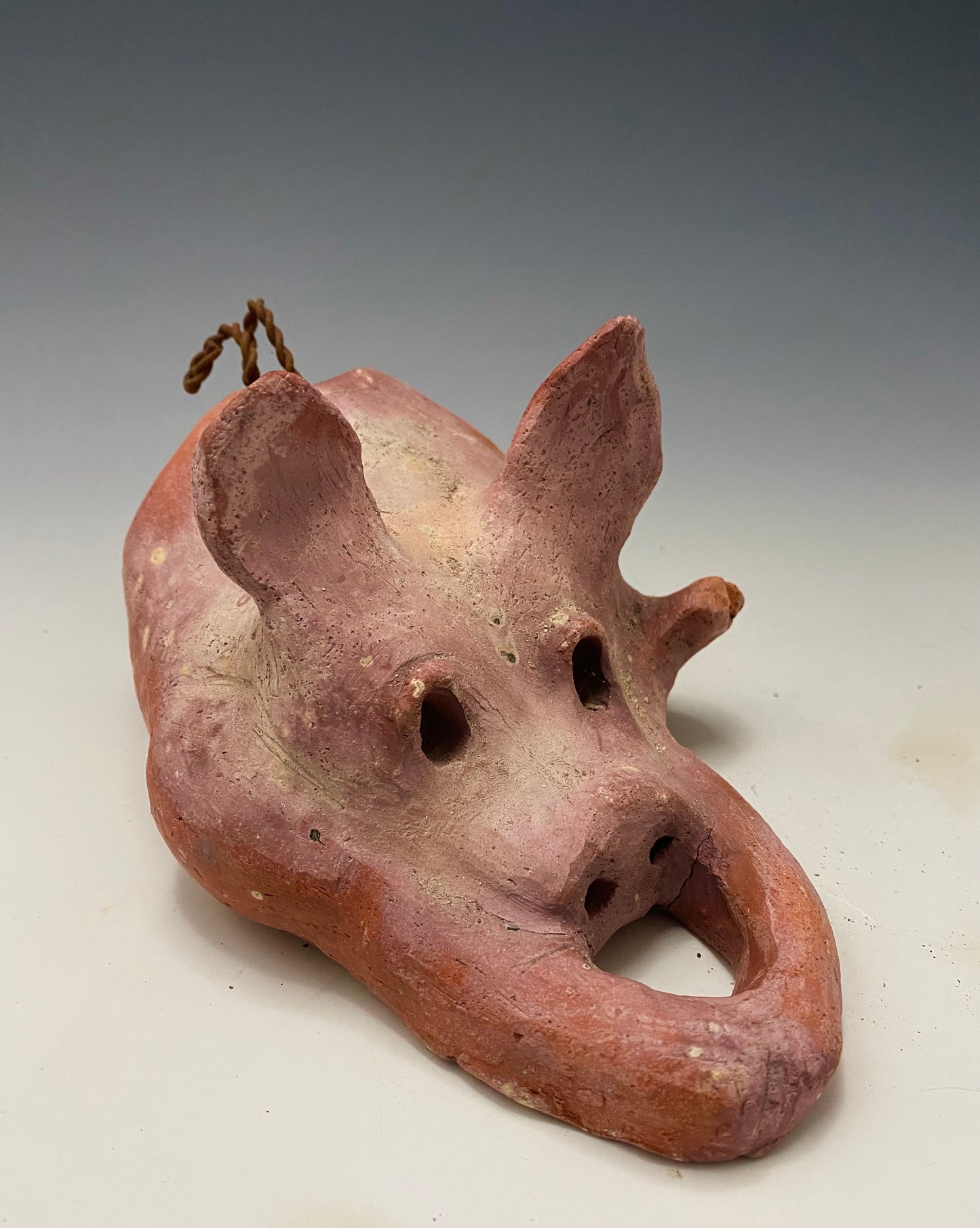 "I have so much fun making this little pig. I started making them about a year ago. I was really surprised at how well they were received at recent art festivals. Boys, girls, men, and women of all ages talked about how cute they are. They got a kick out of and adored the pigs that were named after someone they knew". This Little Piggy named Pauline is 4" x 5' x 8" and weighs 1.8 lbs. Pauline has a matte and satin pinkish complexion. Pauline little curly tail is made of wire