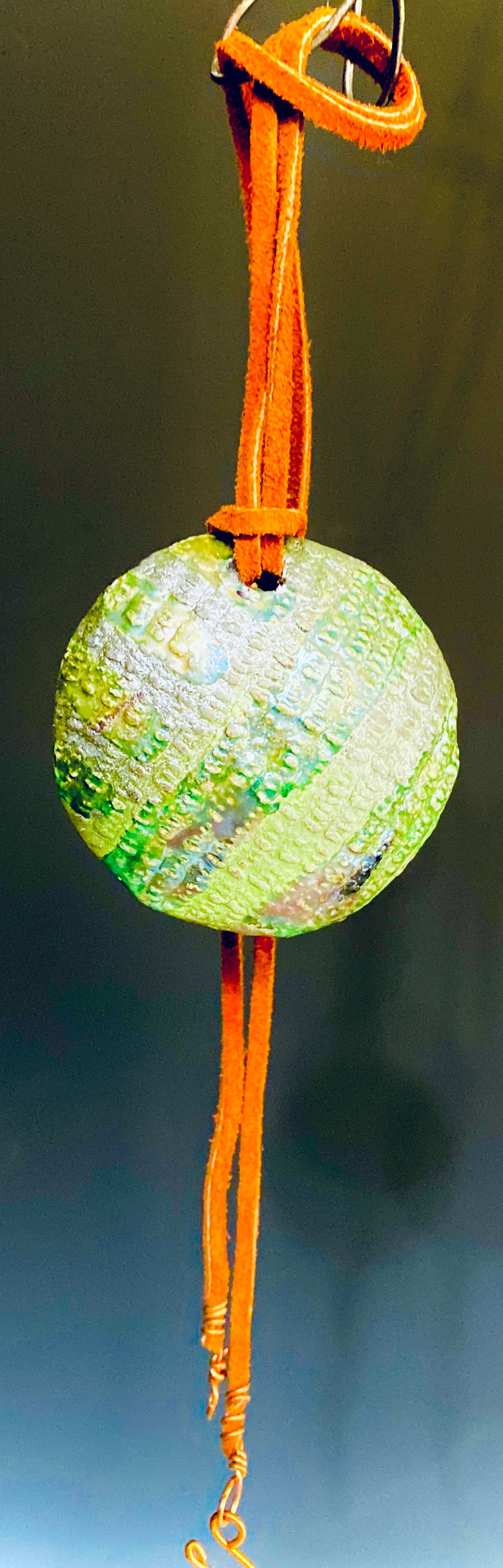 Earthy! 16"  brown suede cord. 1  earthy colored Raku disc Tribal!