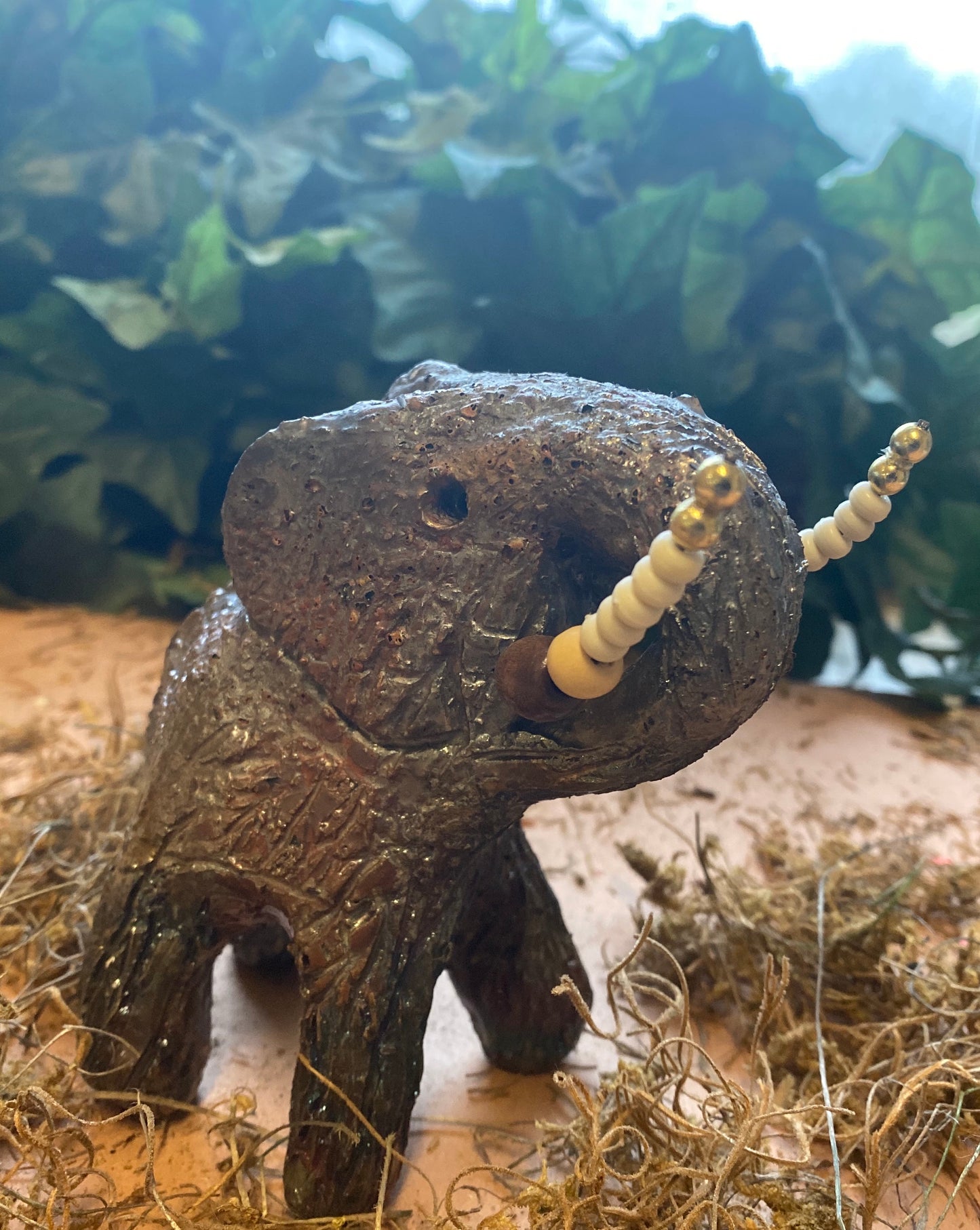 Have you HERD!!!!!! Elephants are one of my favorite animals to create. They are so majestic" Just one of these lovely Raku Fired Elephant will make an excellent gift for your BFF, or just for you . This raku fired elephant sits 5" x 4" x 4" and weighs 1 lbs. She has beaded tusks and a textured copper charcoal body. This one will be nice to add your Herdew Collection!