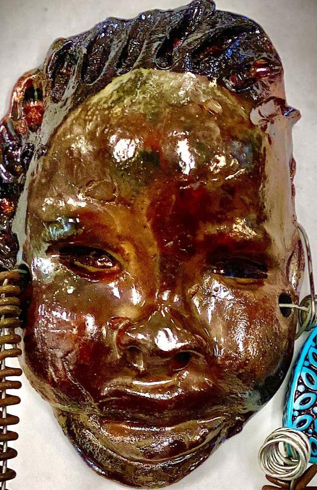 Bani is 6”x3” and weighs 3.6 ozs. He has a glossy copper complexion. Bani has two spiral coils of hair.