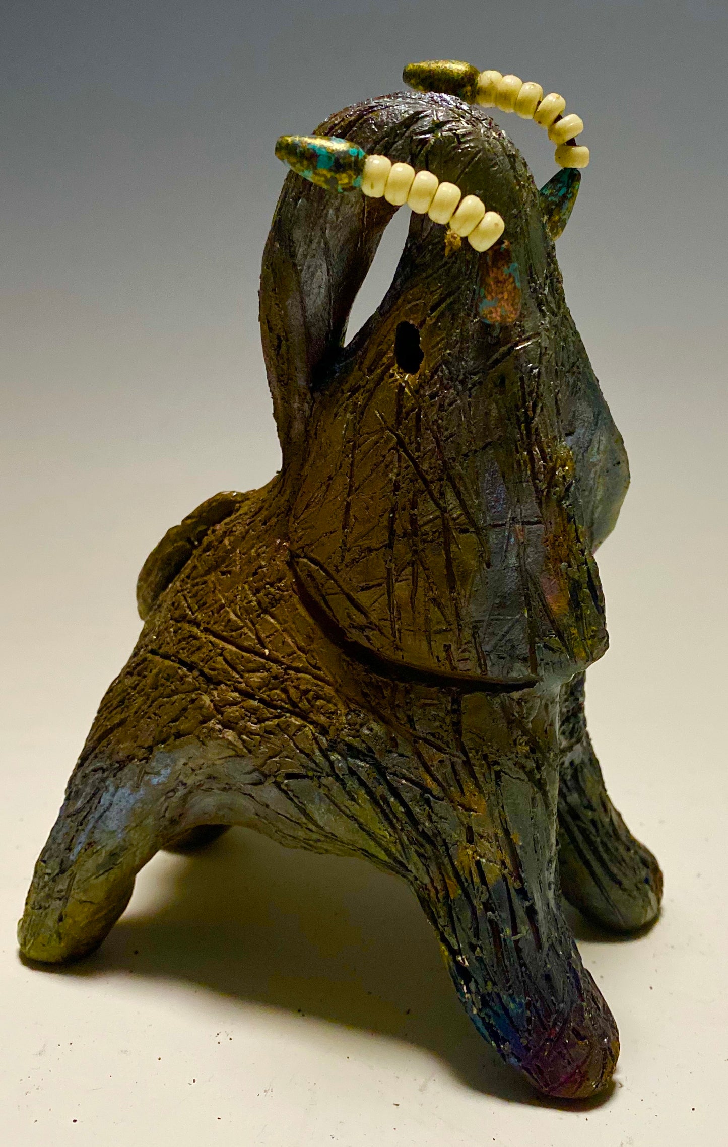 Have you HERD!!!!!! Elephants are one of my favorite animals to create. They are so majestic" Just one of these lovely Raku Fired Elephant will make an excellent gift for your BFF, or just for you . This raku fired elephant stands 6" x 3" x 4.5" and weighs 1 lb. She has beaded tusks and a textured charcoal and copper metallic body. This one will be nice to add your Herdew Collection!