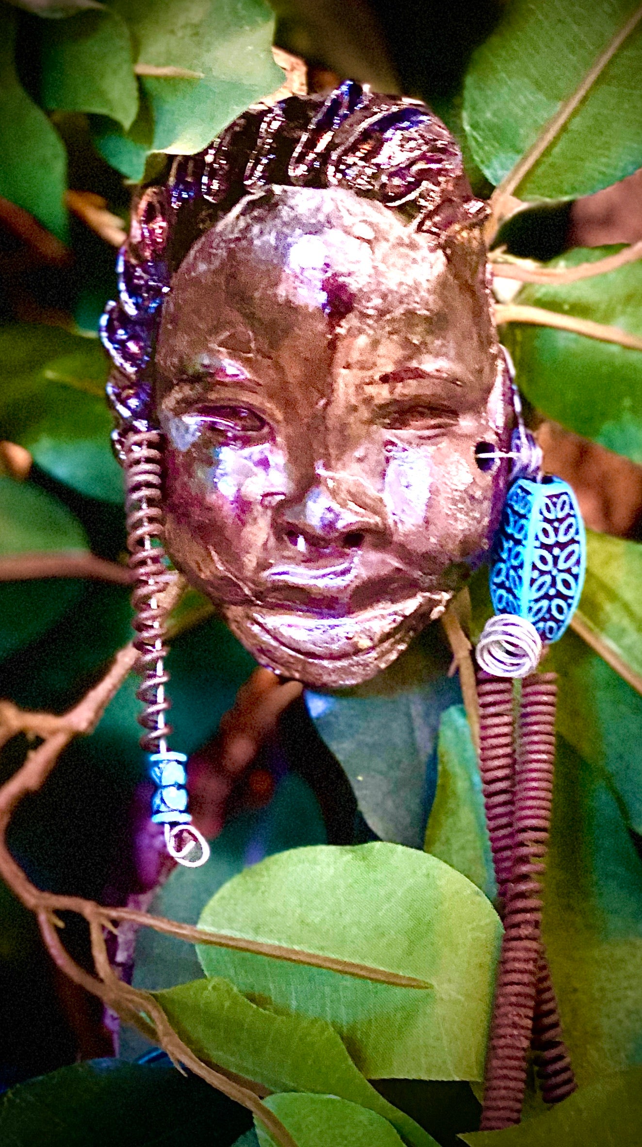 Bani is 6”x3” and weighs 3.6 ozs. He has a glossy copper complexion. Bani has two spiral coils of hair.