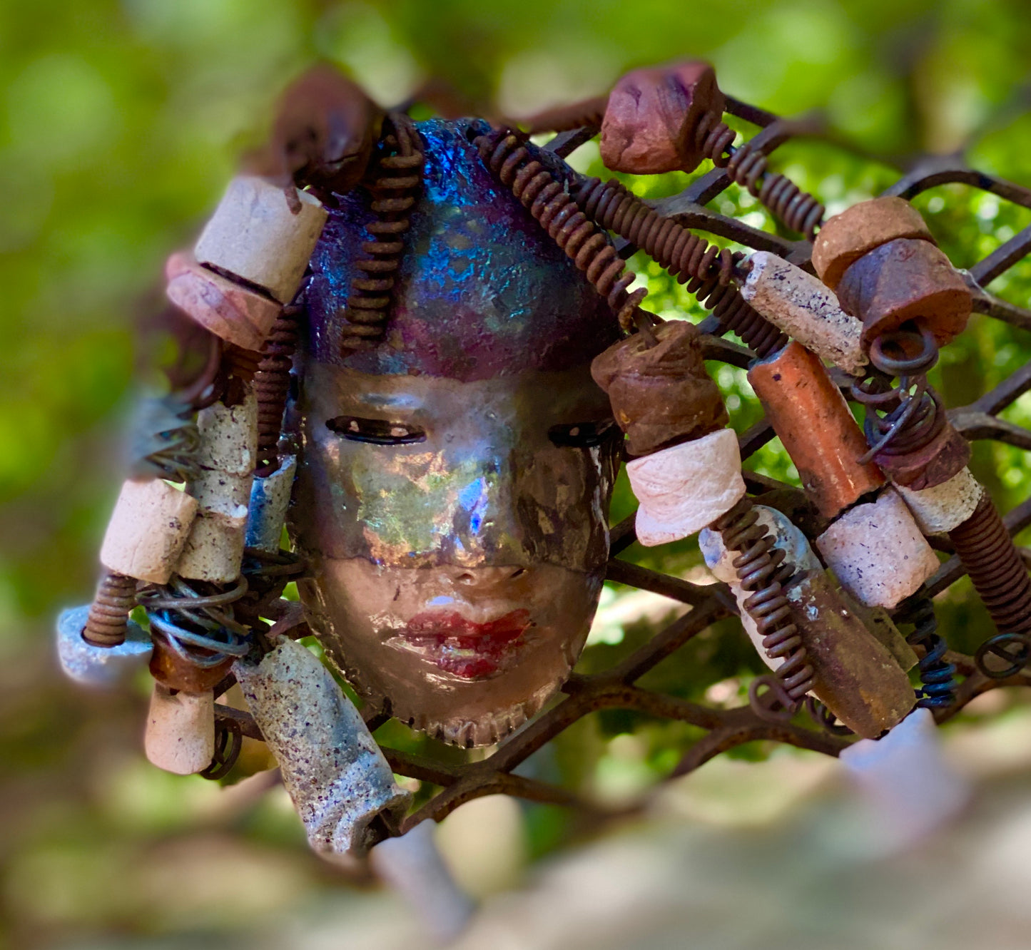 I started making art soon after seeing authentic African artwork at the Smithsonian Museum of African Art. I was in total awe. Jerri was inspired by my visit there. Jerri has a two tone copper gold complexion. She is 8" x 5" and weighs 11 ozs. Jerri has over 20 handmade raku fired beads. Jerri has over 10 feet of copper coiled 16 gauge wire hair.