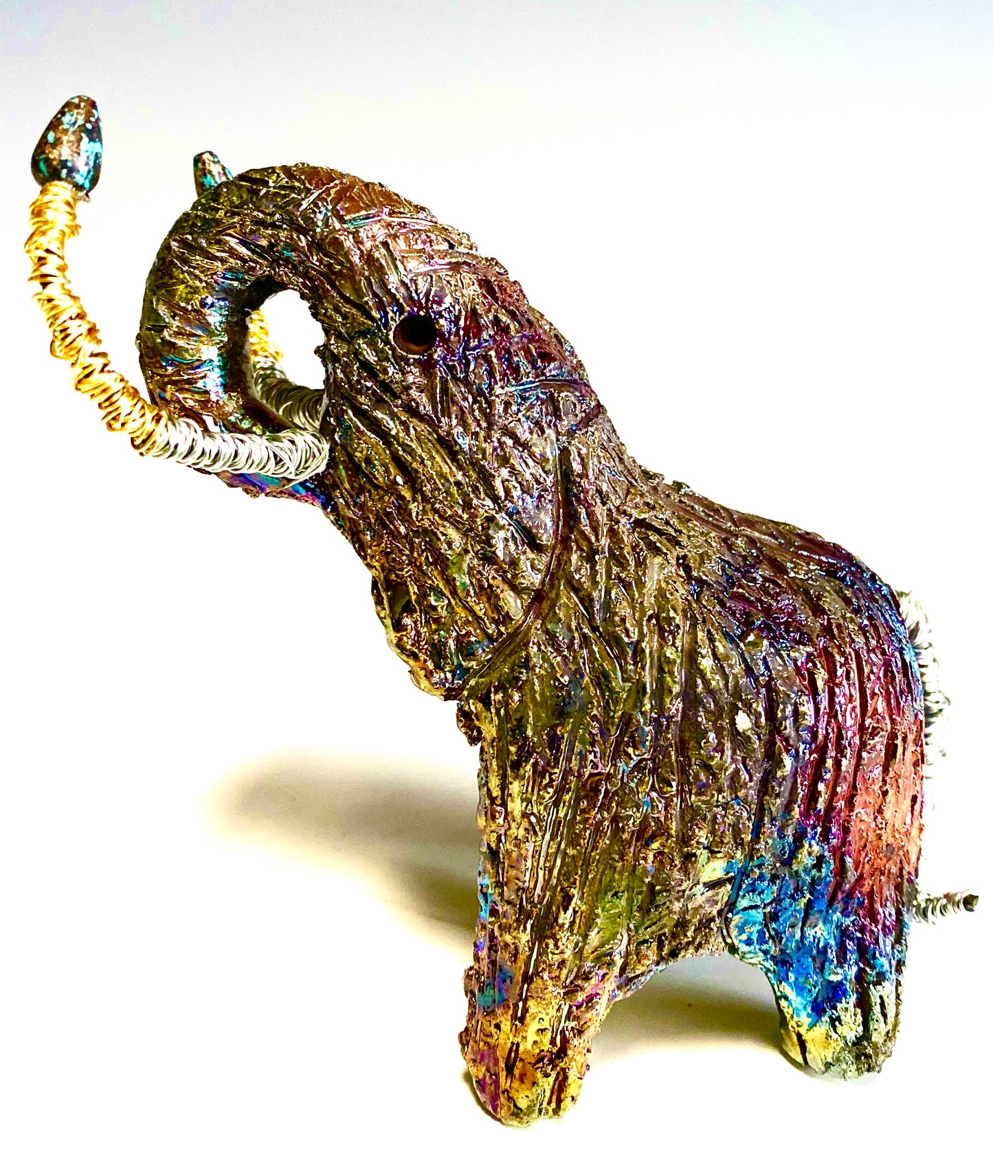 Raku Elephant Have you HERD!!!!!! Just one of these lovely Raku Fired Elephant will make an excellent gift for your friend, sorority or for your home’ special place centerpiece. 5" x 4" x 5" 10 ozs. Beautiful copper metallic raku elephant Copper and silver beaded tusk For decorative purposely only.