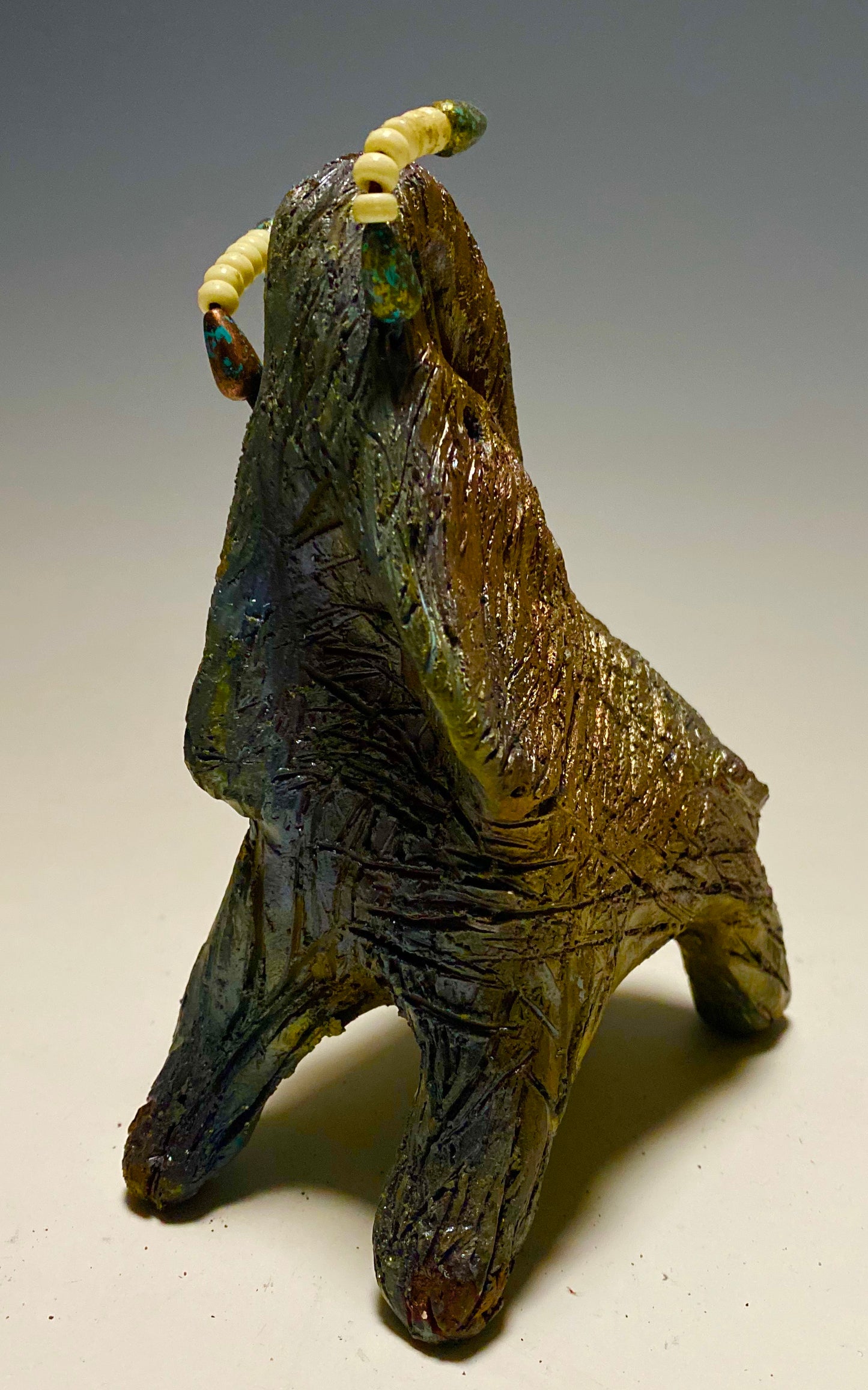 Have you HERD!!!!!! Elephants are one of my favorite animals to create. They are so majestic" Just one of these lovely Raku Fired Elephant will make an excellent gift for your BFF, or just for you . This raku fired elephant stands 6" x 3" x 4.5" and weighs 1 lb. She has beaded tusks and a textured charcoal and copper metallic body. This one will be nice to add your Herdew Collection!