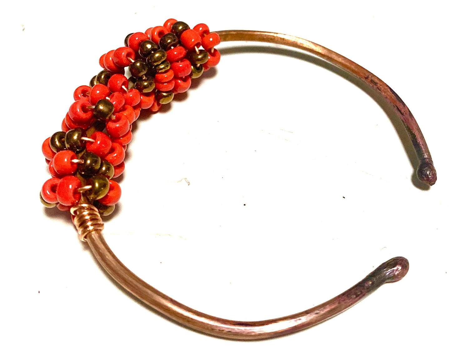 Multi colored red orange and tan beads soft copper band for easy opening adjustments ball ends