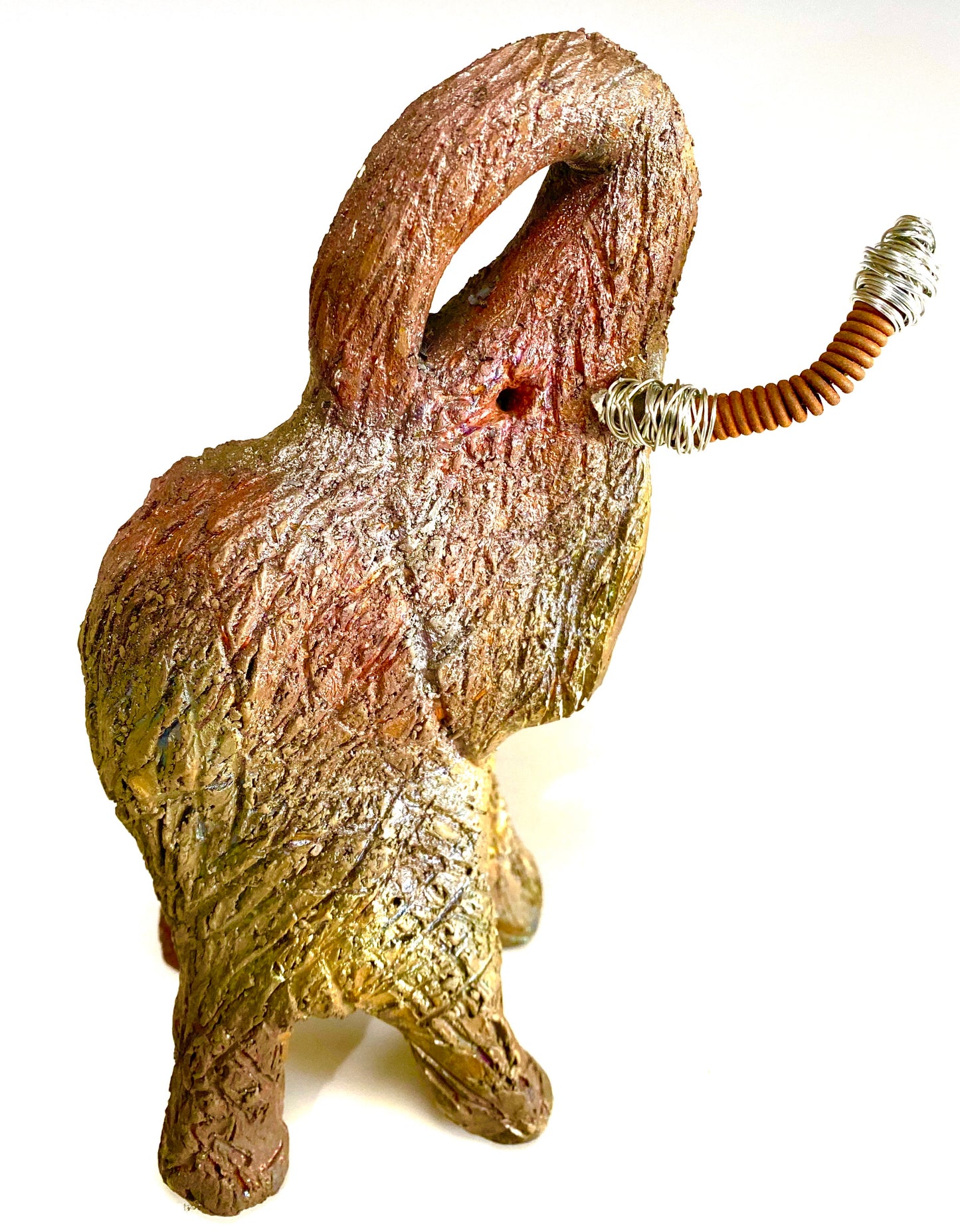 Raku Elephant Have you HERD!!!!!! Just one of these lovely Raku Fired Elephant will make an excellent gift for your friend, sorority or for your home’ special place centerpiece. 6" x 5" x 5" 1 lbs Beautiful metallic raku elephant For decorative purposely only