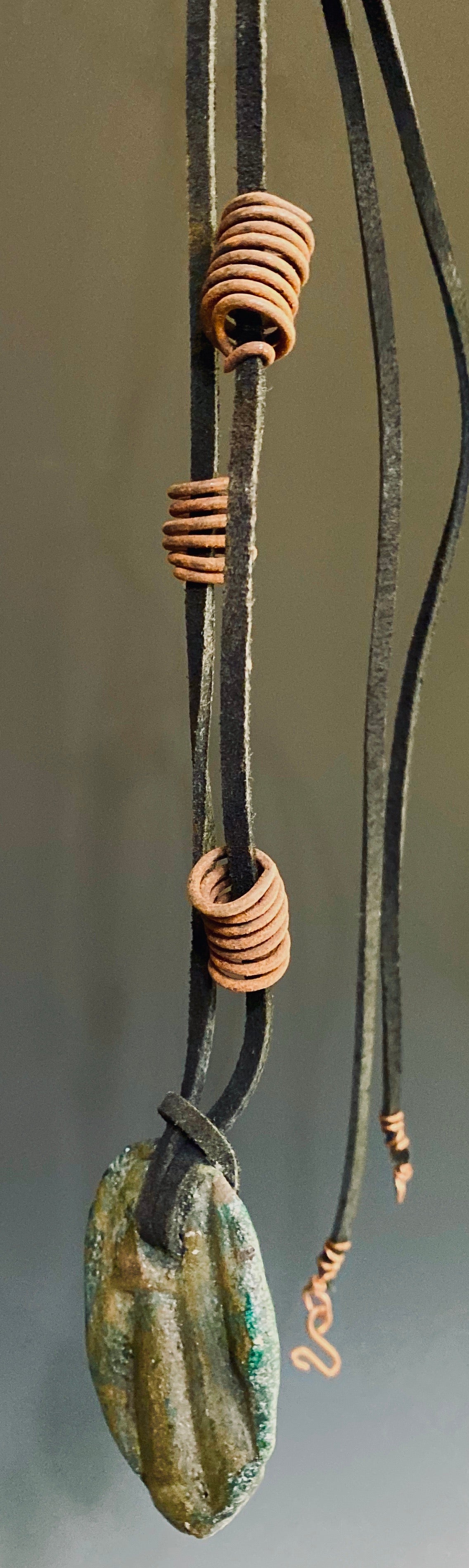 Earthy! 16" brown suede cord. 1 earthy colored Raku disc spiral wire coils Tribal!