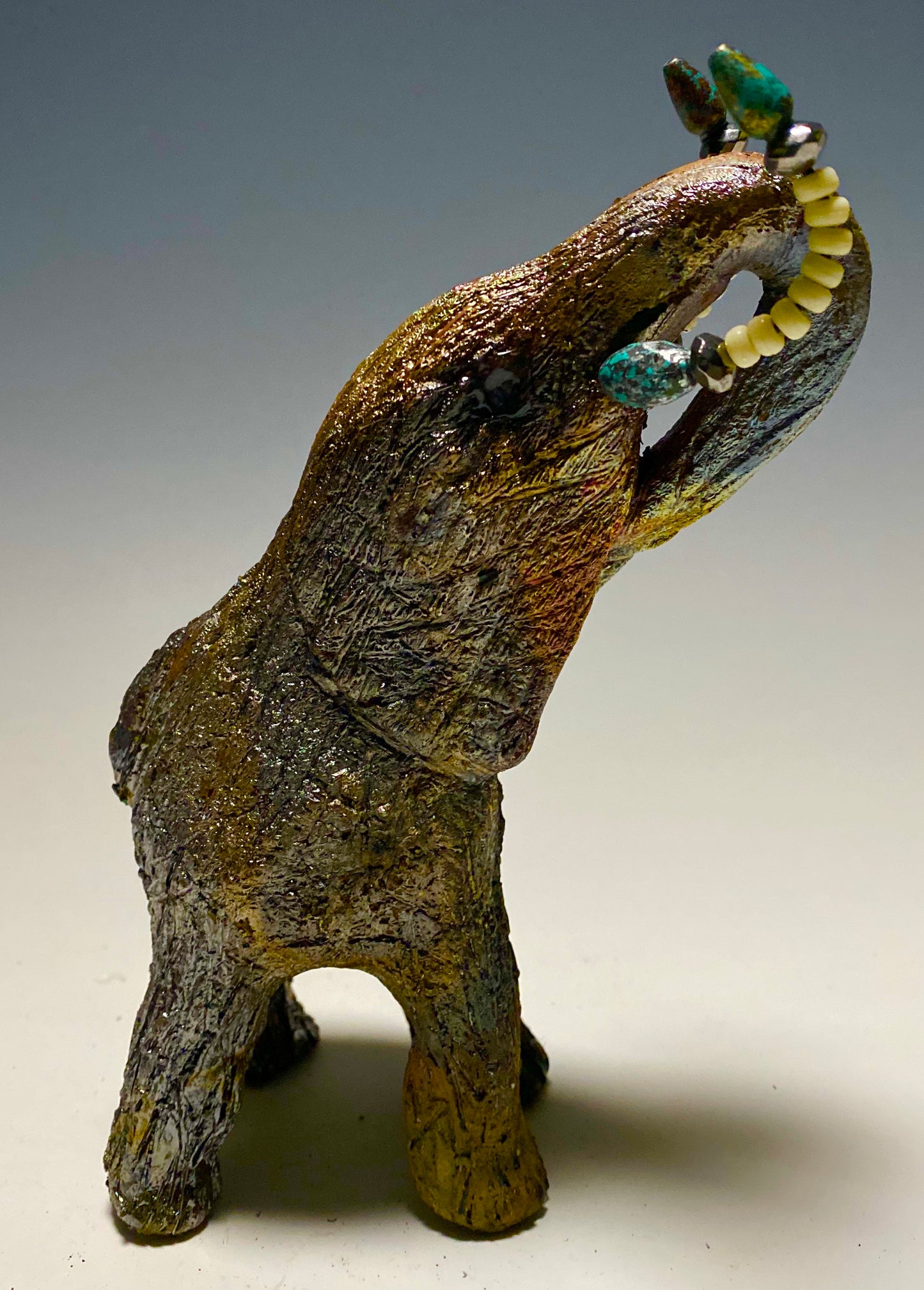 Raku Elephant Have you HERD!!!!!! Just one of these lovely Raku Fired Elephant will make an excellent gift for your friend, sorority or for your home’ special place centerpiece. 7" x 4" x 4" 1 lbs Beautiful colorful metallic matte raku elephant For decorative purposely only