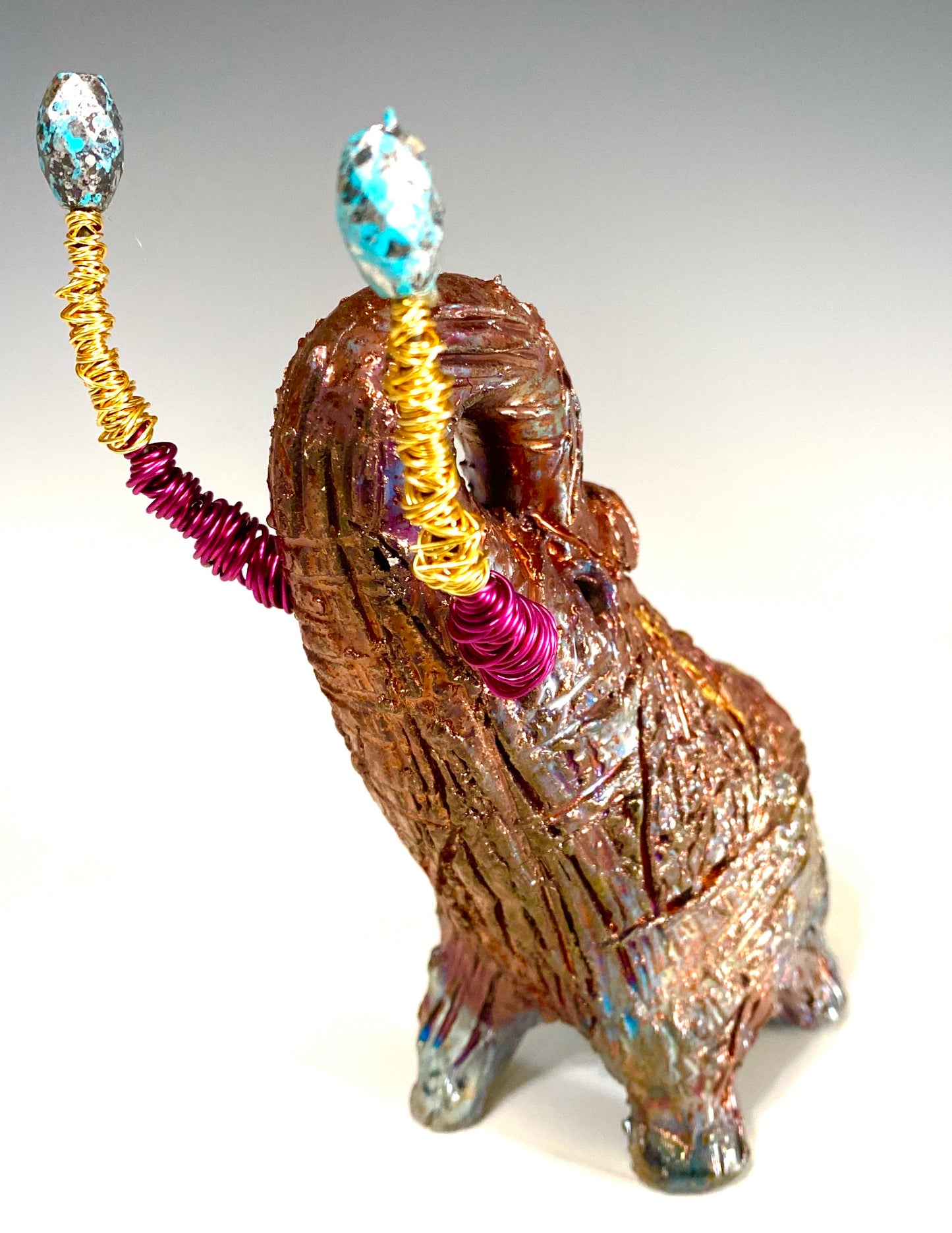 Raku Elephant Have you HERD!!!!!! Just one of these lovely Raku Fired Elephant will make an excellent gift for your friend, sorority or for your home’ special place centerpiece. 6" x 3" x 5" 1 lbs Beautiful metallic raku elephant For decorative purposely only