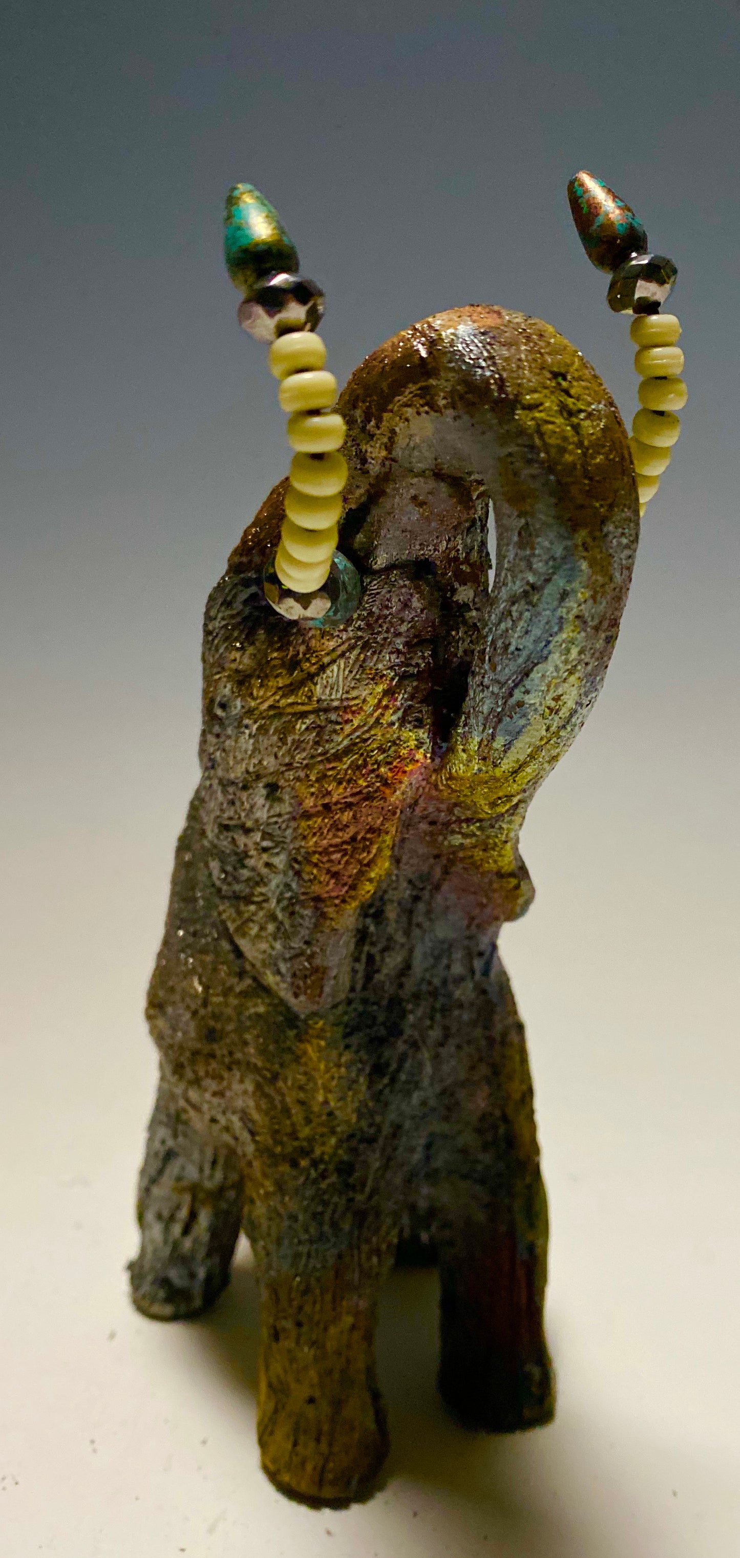 Raku Elephant Have you HERD!!!!!! Just one of these lovely Raku Fired Elephant will make an excellent gift for your friend, sorority or for your home’ special place centerpiece. 7" x 4" x 4" 1 lbs Beautiful colorful metallic matte raku elephant For decorative purposely only