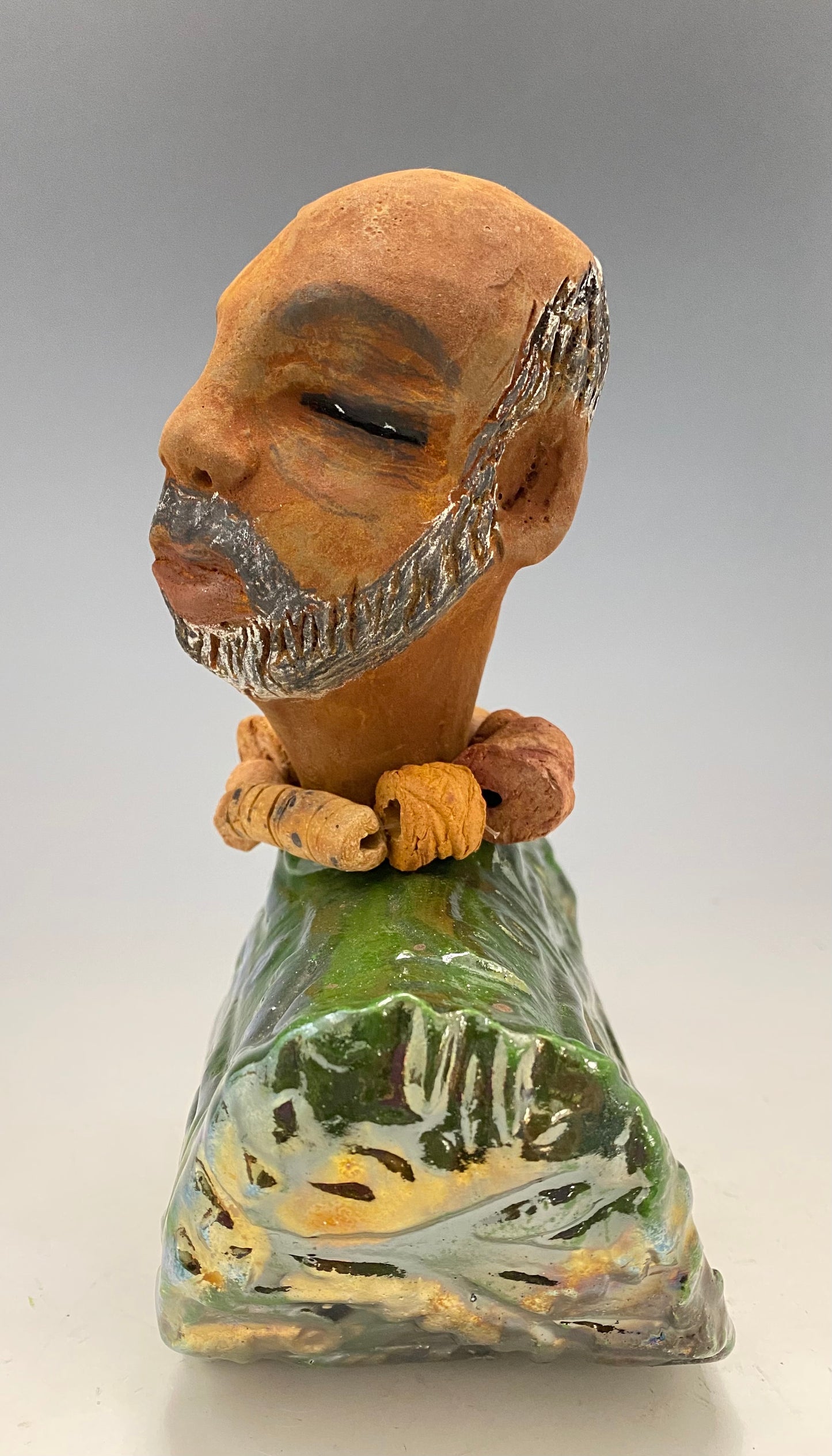 Learning to draw is really a matter of learning to see - to see correctly - and that means a good deal more than merely looking with the eye.- Lester Jones Meet James! Albert stands 7.5" x 6" x 3" and weighs 2.5lbs. Albert wears a colorful metallic copper green dashiki. He is partially bald with a salt and peppered beard. Yes ,,,,,,He is one of few Men found in the Herdew collection!