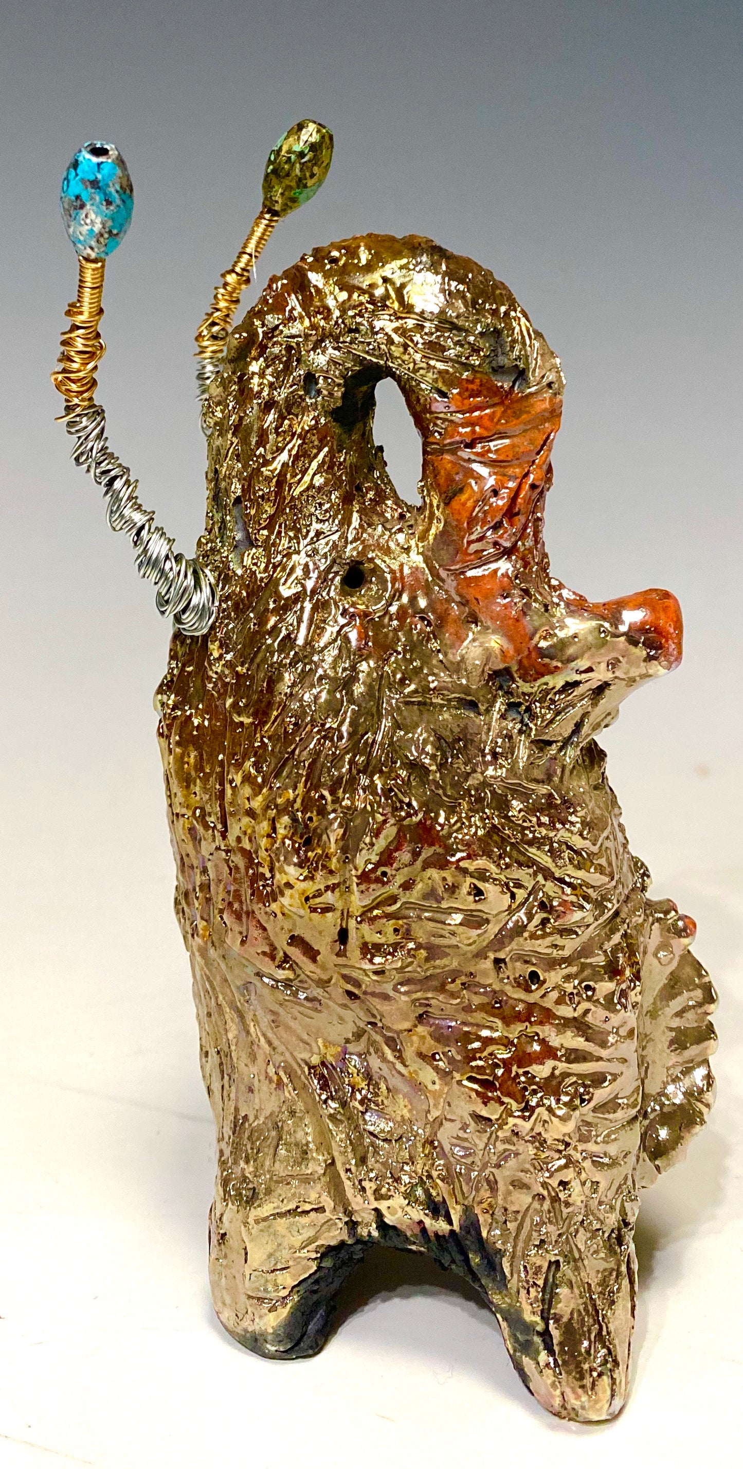 Raku Elephant Have you HERD!!!!!! Just one of these lovely Raku Fired Elephant will make an excellent gift for your friend, sorority or for your home’ special place centerpiece. 6.5" x 3" x 4" 10 ozs Silver and gold beaded tusk Beautiful gold metallic raku elephant For decorative purposely only