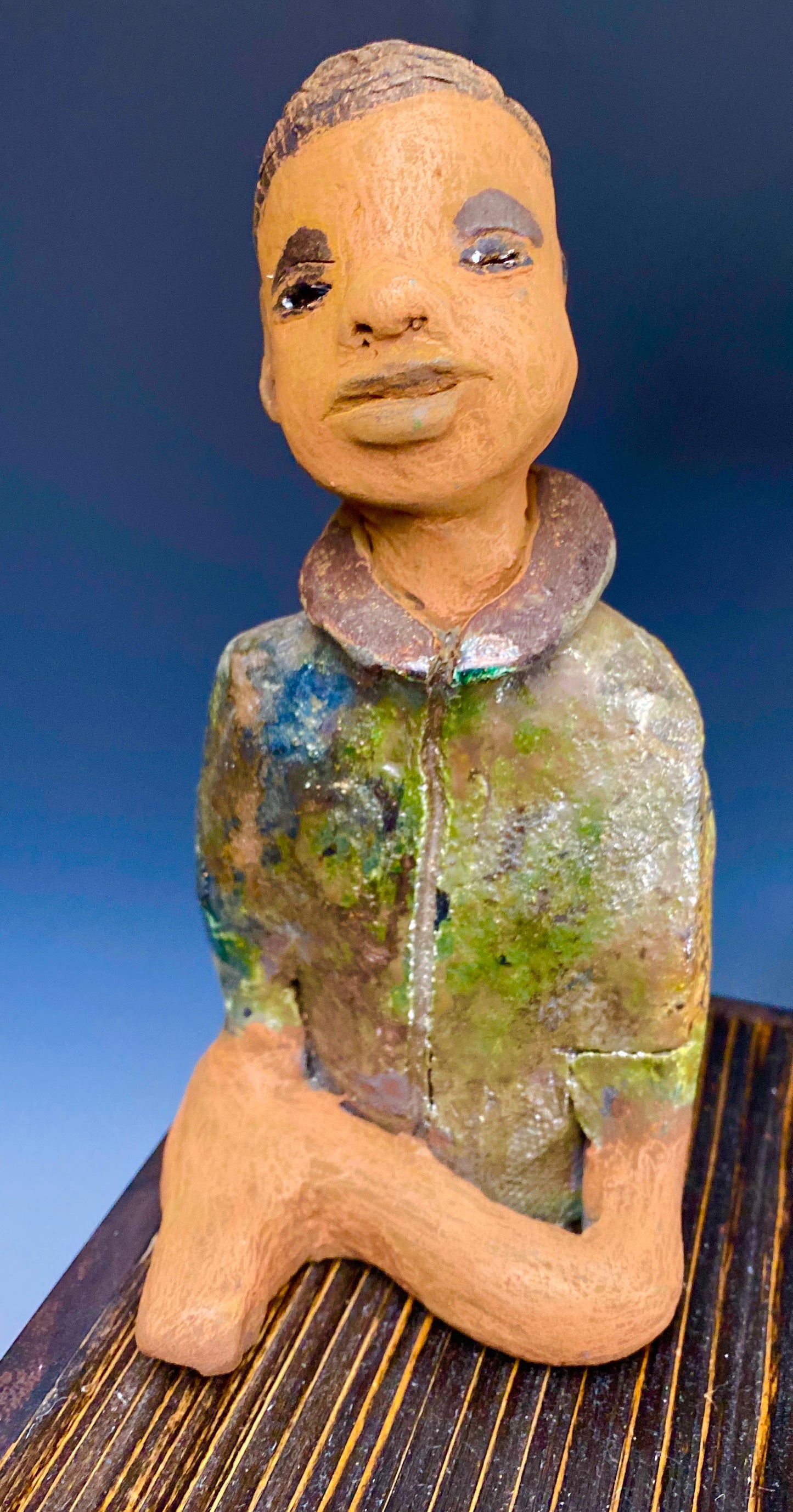Ray is one confident teen who is ready to make his mark! Ray stands 7"x 3" x 3" and weighs 14 ozs. He has a green metallic jacket with a high collar . Ray complexion is honey brown. His arms are folded as he ponders which college scholarship to accept!!