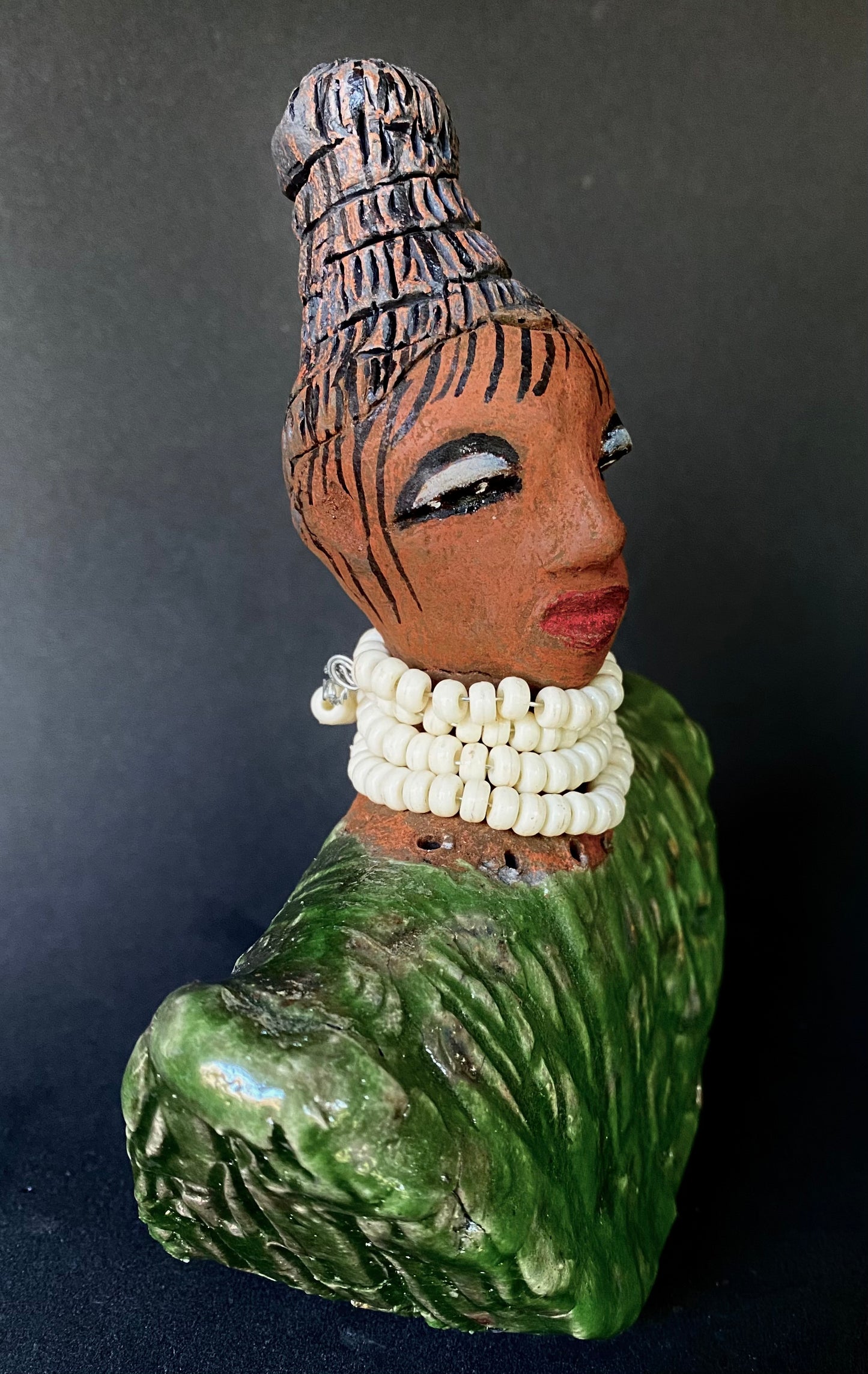 Meet Kayla! Kayla looks ready for an exciting evening out! Kayla stands 6" x 5" x 3 and weighs 14 ozs. Kayla has a nice honey brown complexion and wears glasses. She wear etched clay hair styled in a bun. Kayla wears a textured white crackle robe. She is angelic! Kayla will make a great gift or starter piece from the Herdew Collection! Check out our Shipping and Return policy