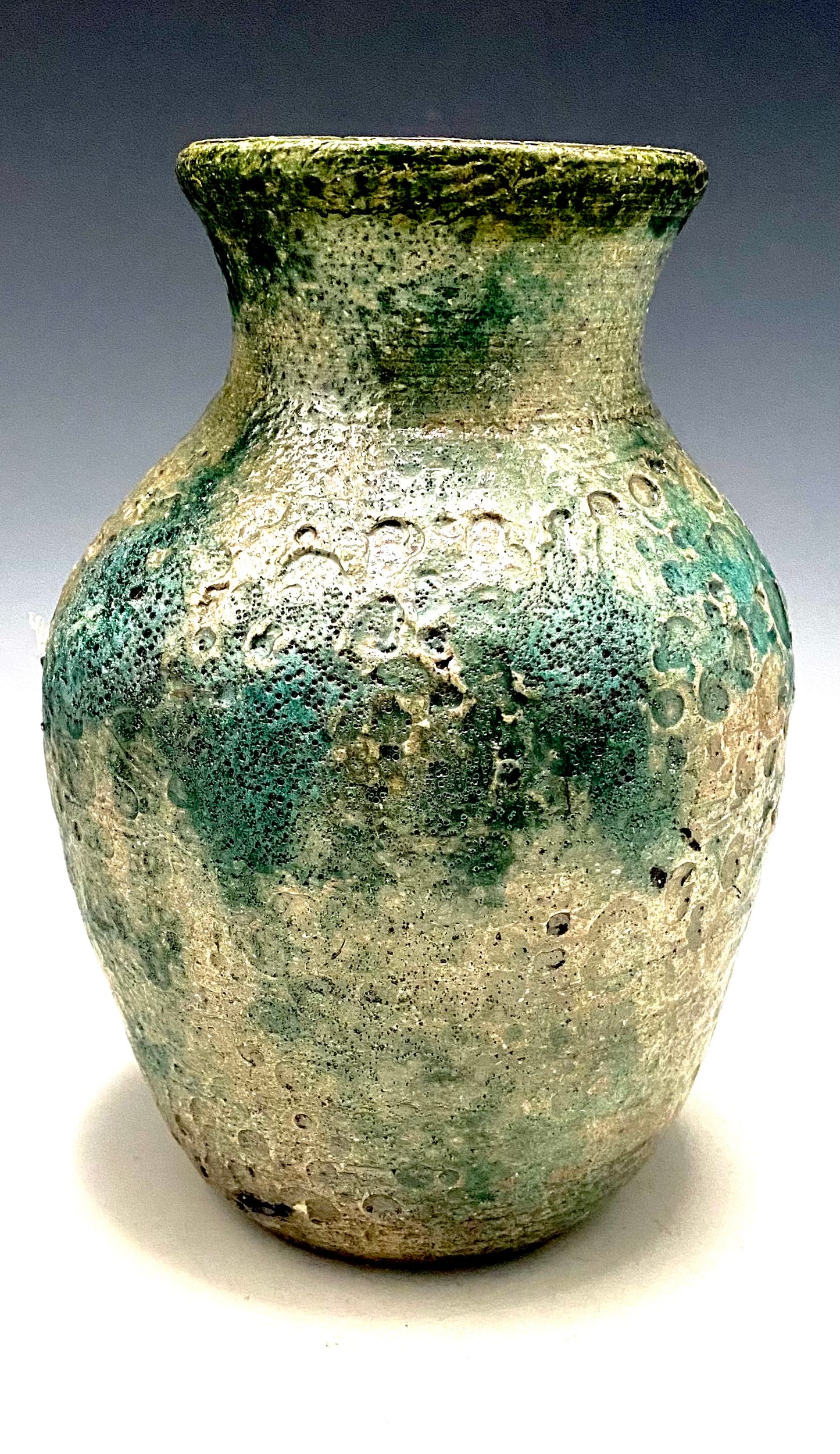 This lovely textured vase stands 7" x %" x 5" 1.7 lbs Beautiful moss metallic raku For decorative purposely only Nice with accessories or stand alone. Got Questions????