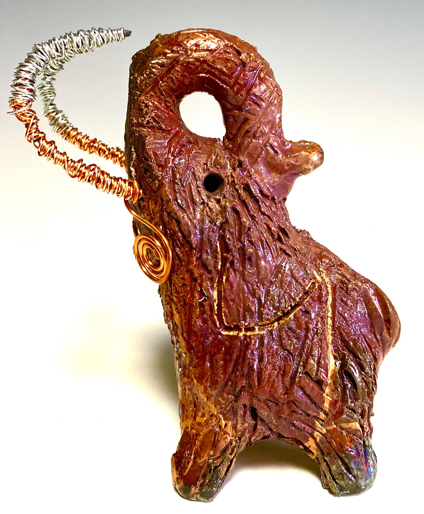 Raku Elephant Have you HERD!!!!!! Just one of these lovely Raku Fired Elephant will make an excellent gift for your friend, sorority or for your home’ special place centerpiece. 6" x 4" x 5" 10 ozs. Beautiful copper metallic raku elephant Copper and silver tusk For decorative purposely only.