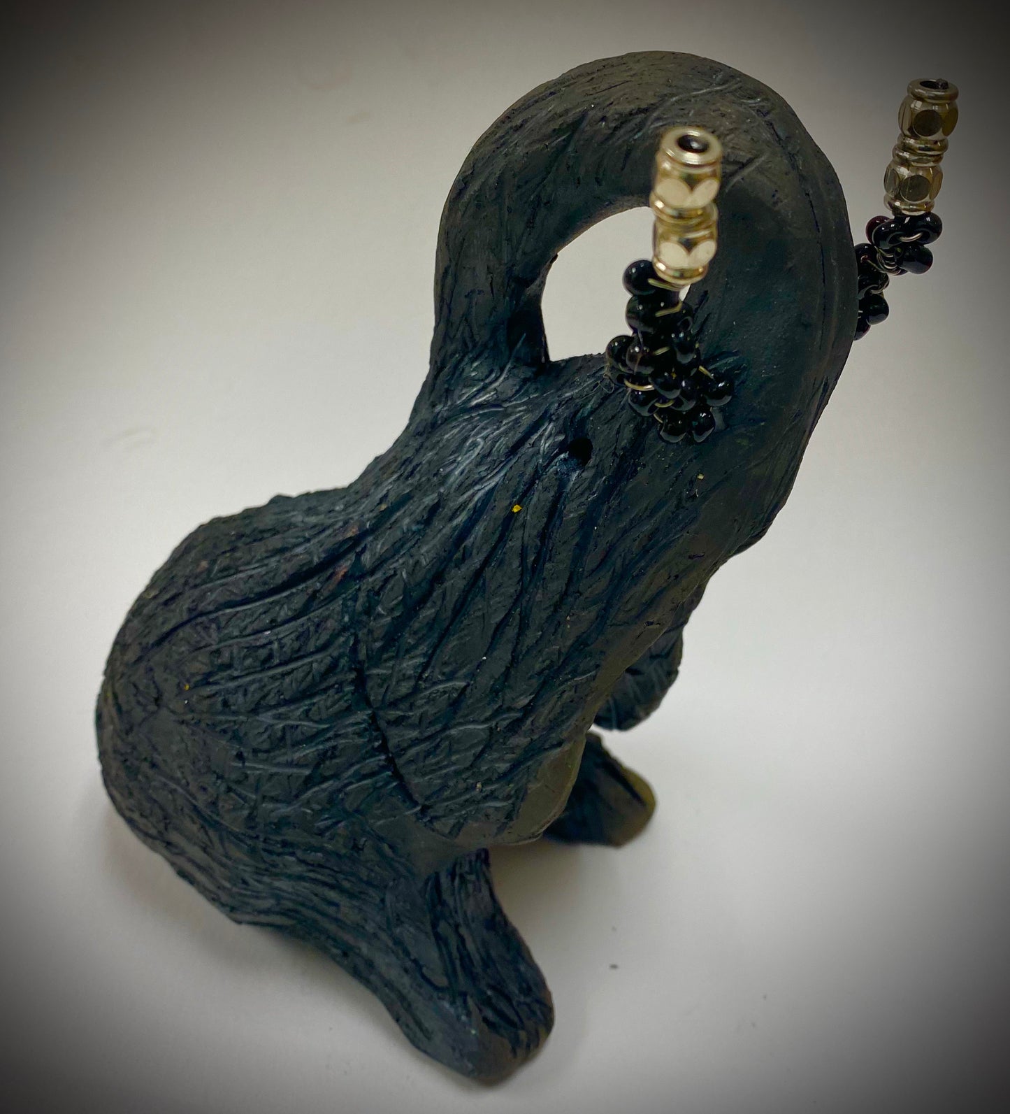 Have you HERD!!!!!! Elephants are one of my favorite animals to create. They are so majestic" Just one of these lovely Raku Fired Elephant will make an excellent gift for your BFF, or just for you . This raku fired elephant stands 7" x 2" x 2.5" and weighs 10 ounces. She has beaded tusks and a textured charcoal body. Nice!