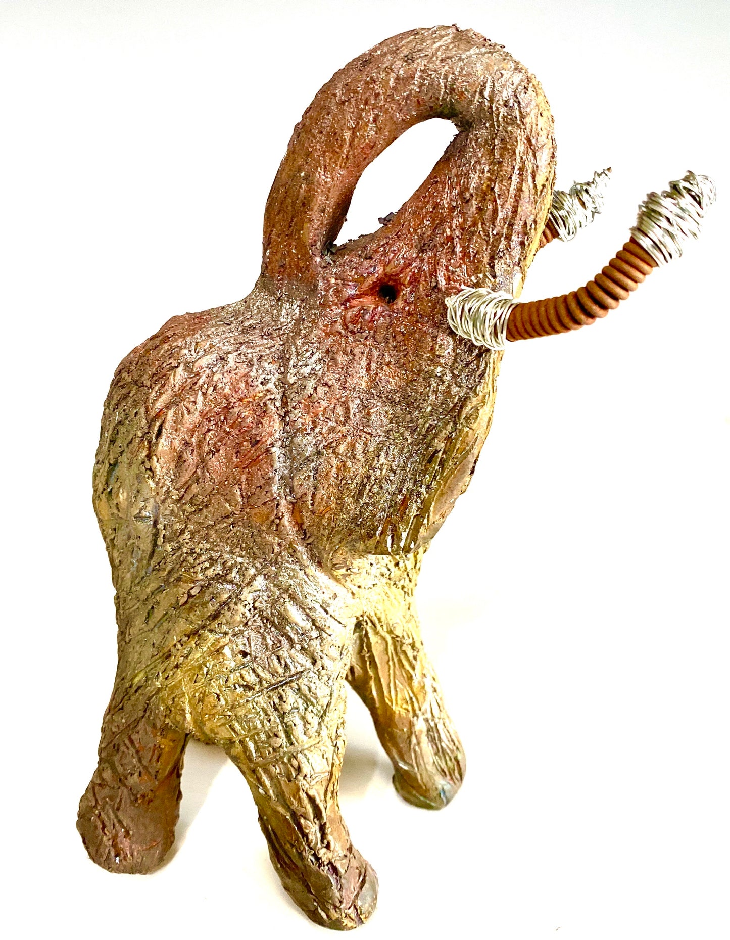 Raku Elephant Have you HERD!!!!!! Just one of these lovely Raku Fired Elephant will make an excellent gift for your friend, sorority or for your home’ special place centerpiece. 6" x 5" x 5" 1 lbs Beautiful metallic raku elephant For decorative purposely only