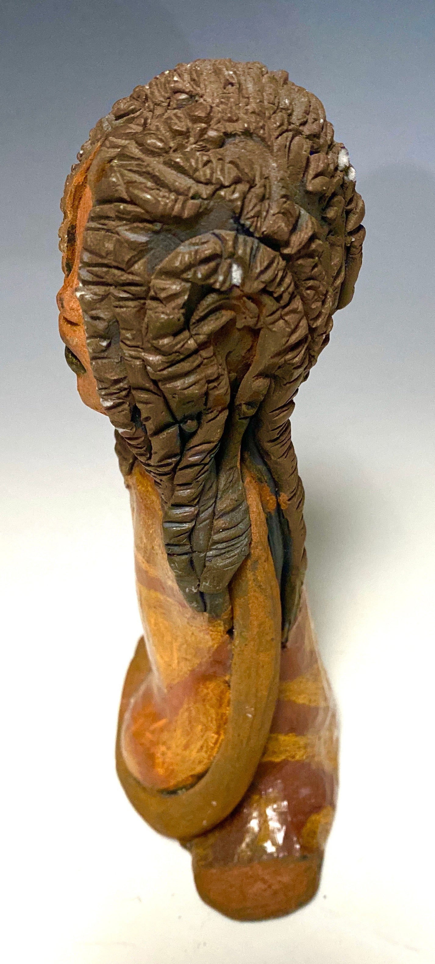 Meet Bree! Bree stands 7.5' x 4.5" x 2.5" and weighs 11 ozs. She has a lovely honey brown complexion. Bree wears a golden brown striped dress. Her hair is smokey black .and made of clay. Bree's long loving arms rest at her side.