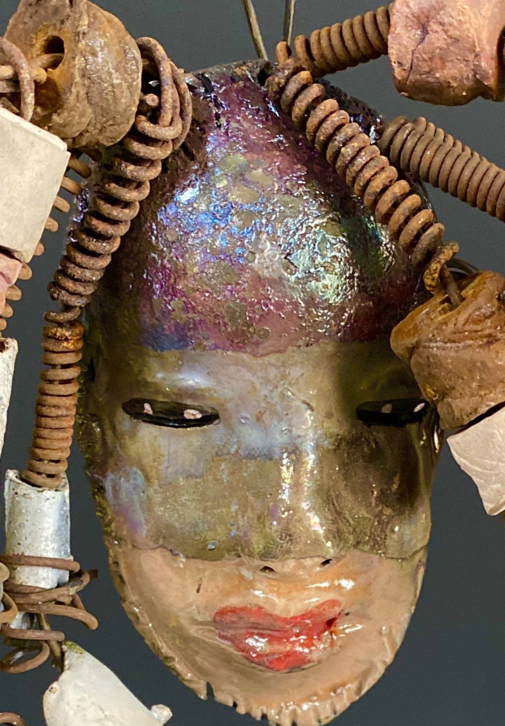 I started making art soon after seeing authentic African artwork at the Smithsonian Museum of African Art. I was in total awe. Jerri was inspired by my visit there. Jerri has a two tone copper gold complexion. She is 8" x 5" and weighs 11 ozs. Jerri has over 20 handmade raku fired beads. Jerri has over 10 feet of copper coiled 16 gauge wire hair.