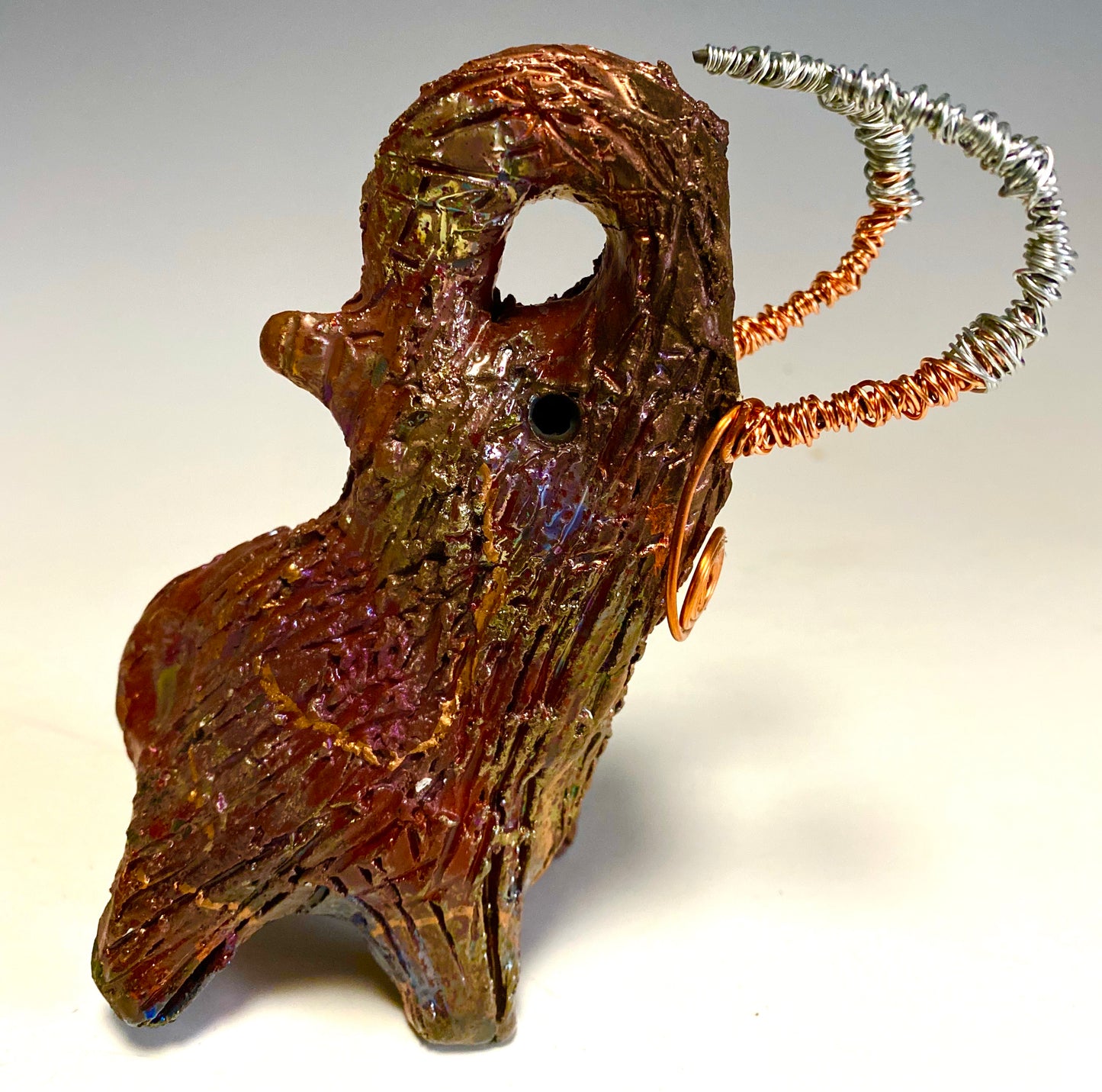 Raku Elephant Have you HERD!!!!!! Just one of these lovely Raku Fired Elephant will make an excellent gift for your friend, sorority or for your home’ special place centerpiece. 6" x 4" x 5" 10 ozs. Beautiful copper metallic raku elephant Copper and silver tusk For decorative purposely only.
