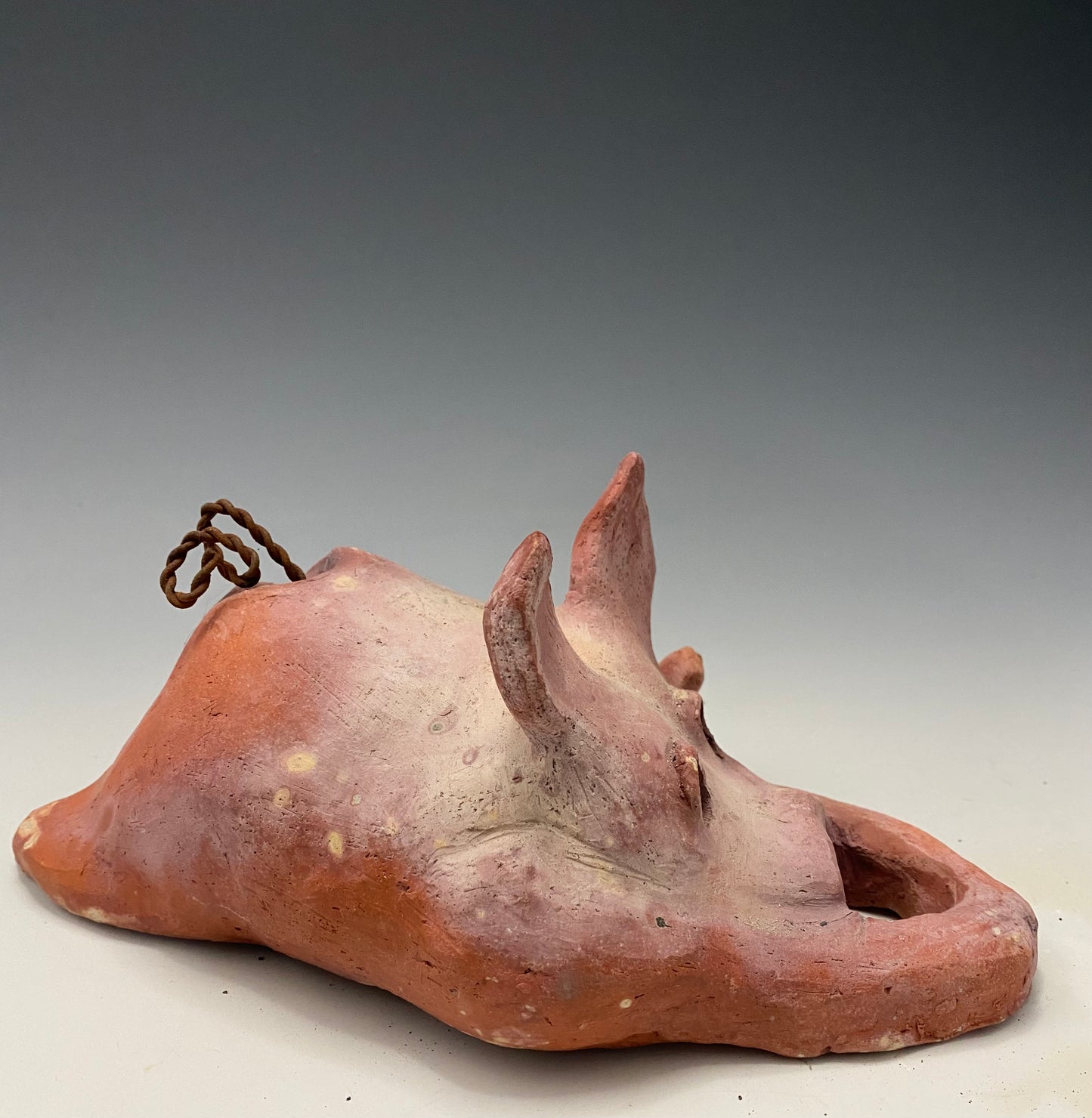 "I have so much fun making this little pig. I started making them about a year ago. I was really surprised at how well they were received at recent art festivals. Boys, girls, men, and women of all ages talked about how cute they are. They got a kick out of and adored the pigs that were named after someone they knew". This Little Piggy named Pauline is 4" x 5' x 8" and weighs 1.8 lbs. Pauline has a matte and satin pinkish complexion. Pauline little curly tail is made of wire