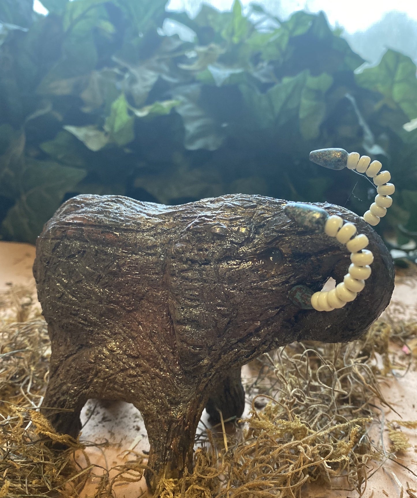 Have you HERD!!!!!! Elephants are one of my favorite animals to create. They are so majestic" Just one of these lovely Raku Fired Elephant will make an excellent gift for your BFF, or just for you . This raku fired elephant sits 4.5" x 3" x 4" and weighs 1 lbs. She has beaded tusks and a textured copper charcoal body. This one will be nice to add your Herdew Collection!